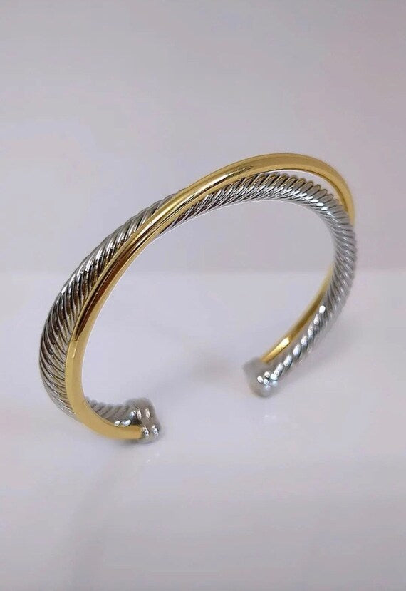 Two Tone Double Cable Bangle featuring 18K Gold Filled accents and a delicate cable pattern.