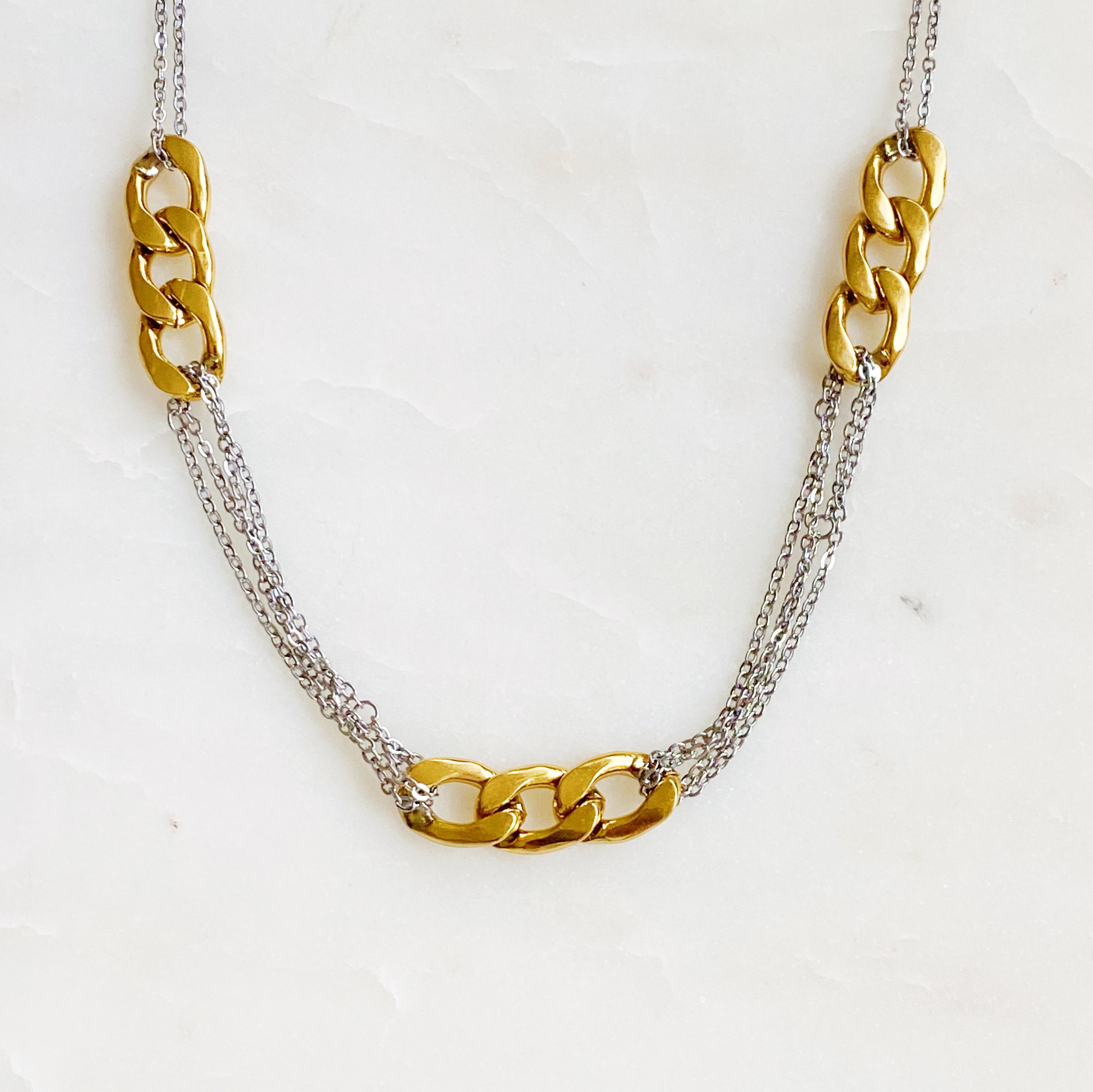 Two Toned Noble Chain Necklace featuring gold and silver tones with bold and dainty chains, perfect for stylish layering.