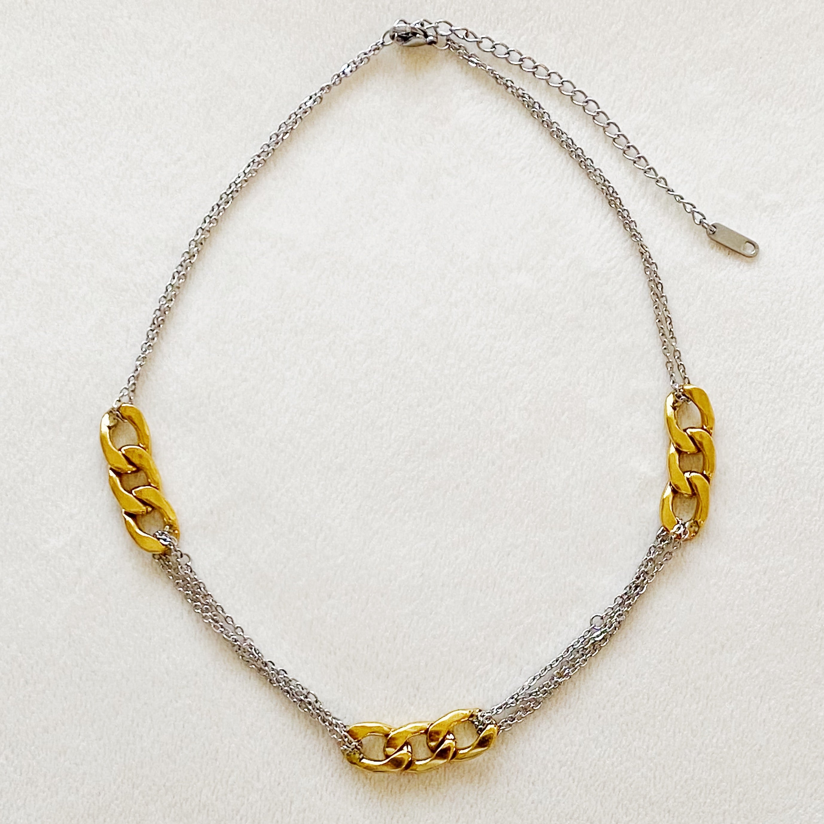 Two Toned Noble Chain Necklace featuring gold and silver tones with bold and dainty chains, perfect for stylish layering.