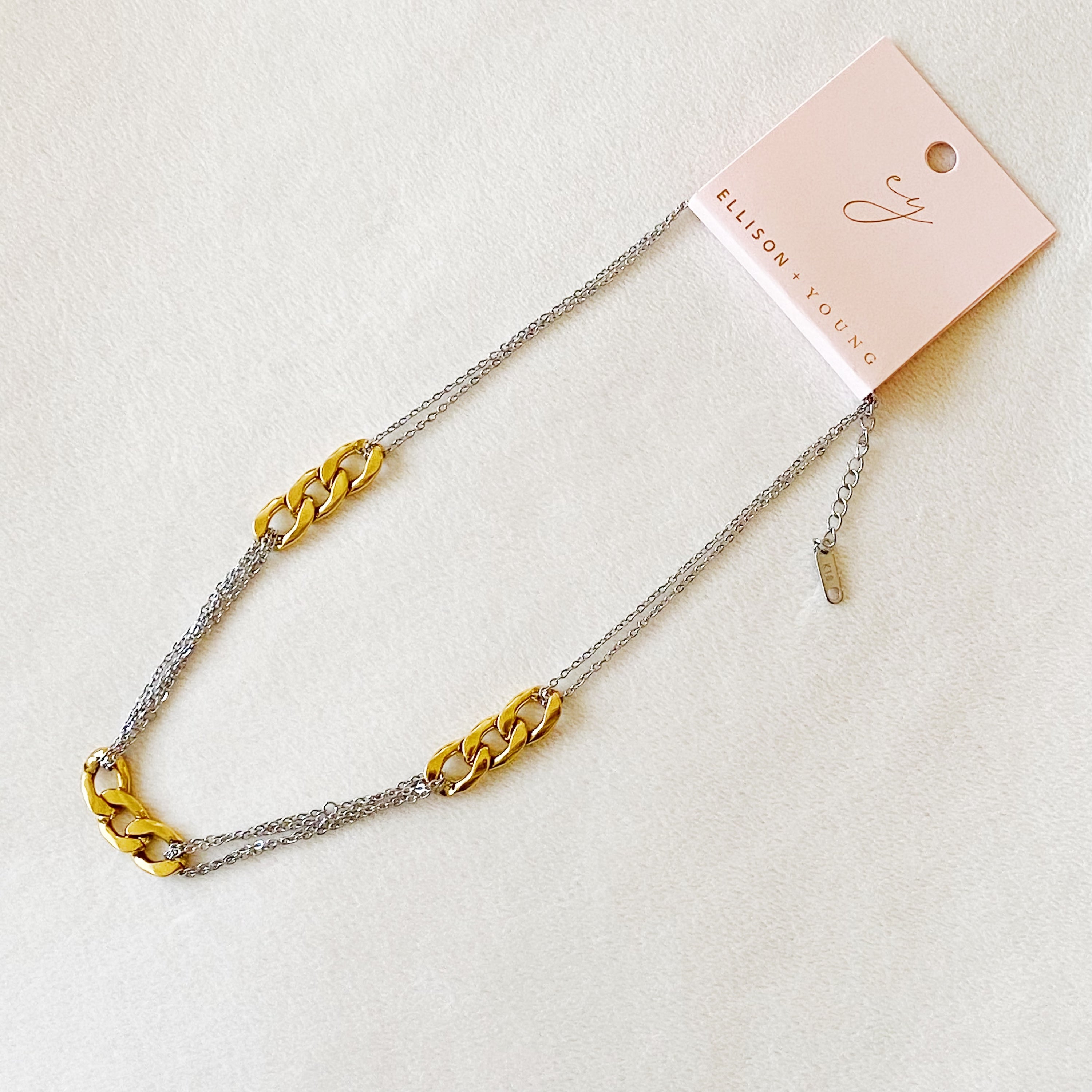 Two Toned Noble Chain Necklace featuring gold and silver tones with bold and dainty chains, perfect for stylish layering.