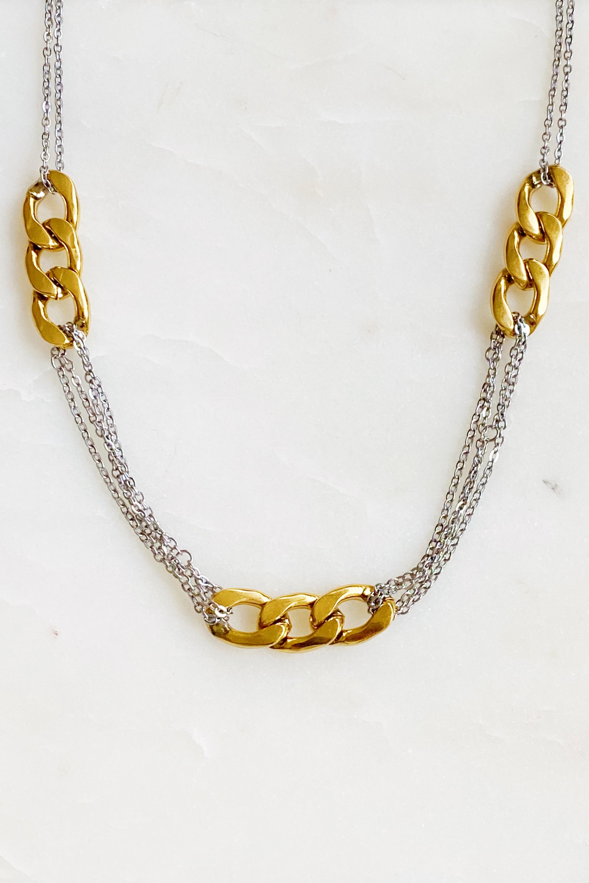 Two Toned Noble Chain Necklace featuring gold and silver tones with bold and dainty chains, perfect for stylish layering.