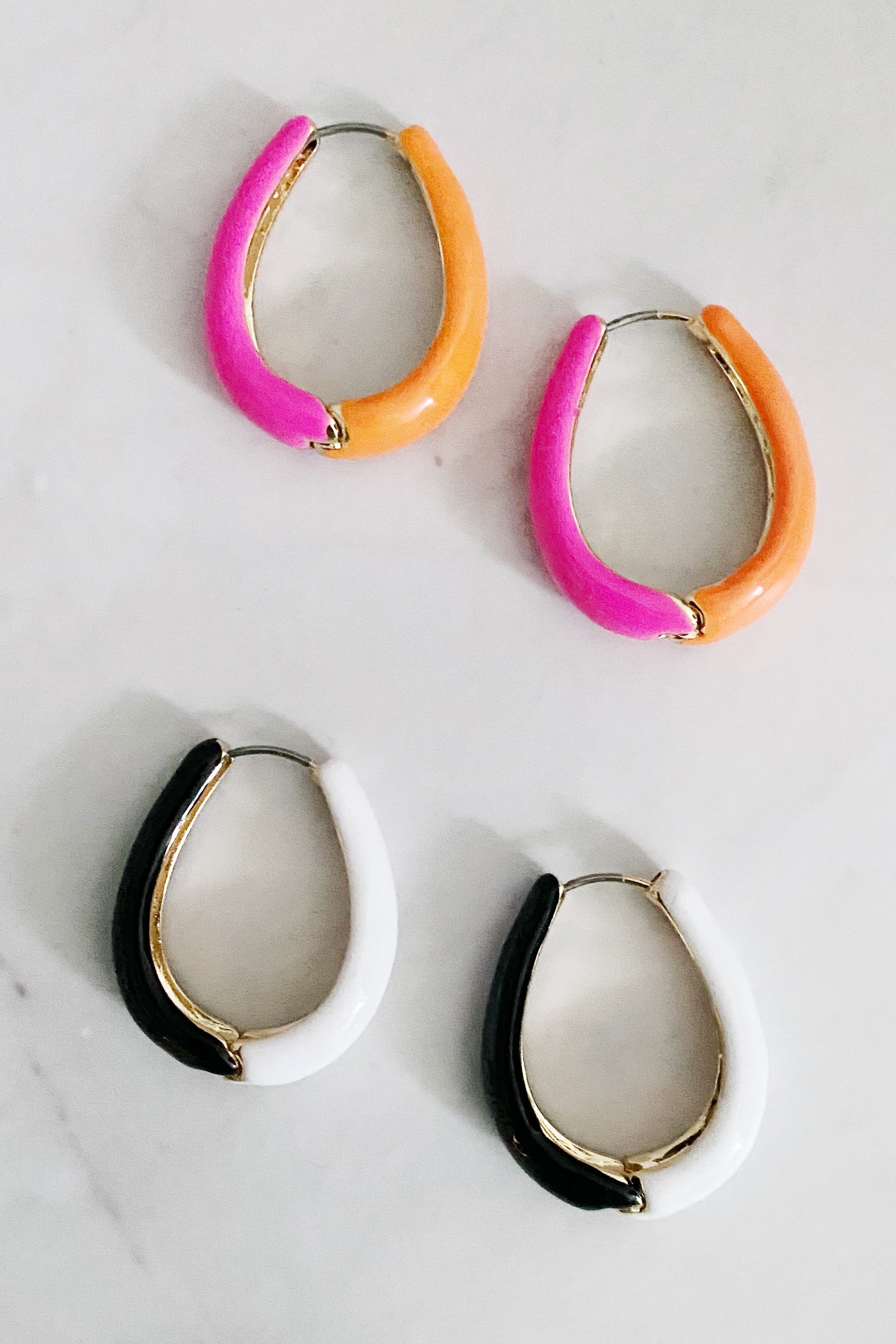 Two Toned Reversible Hoop Earrings featuring gold plating and epoxy color finish, showcasing a stylish and versatile design.