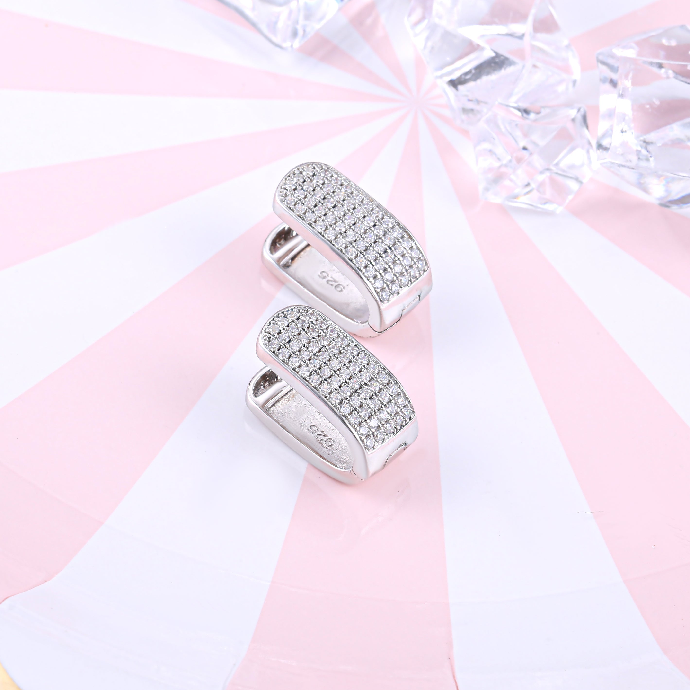 Elegant U shape pave stunning earrings made of 925 sterling silver with white sapphire accents and a white gold finish.