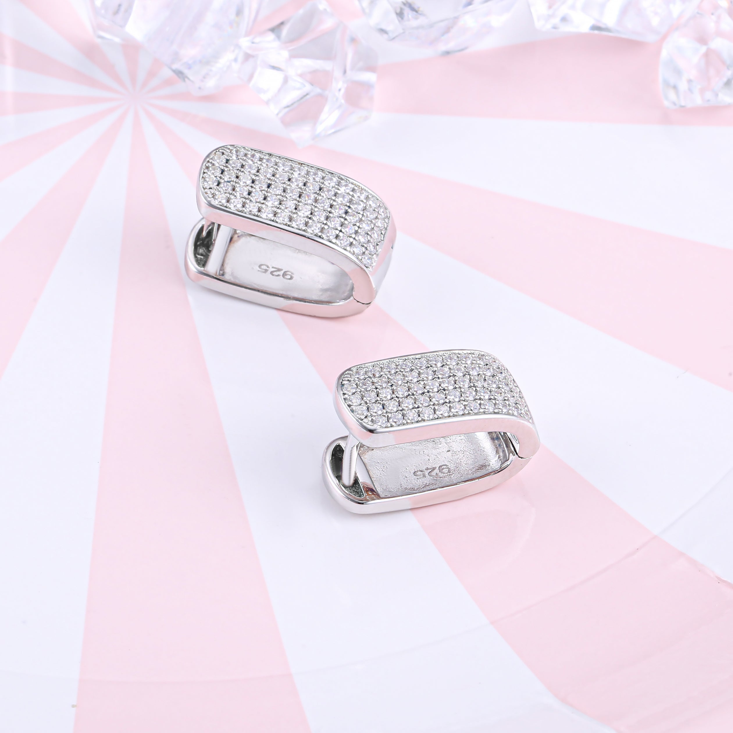 Elegant U shape pave stunning earrings made of 925 sterling silver with white sapphire accents and a white gold finish.