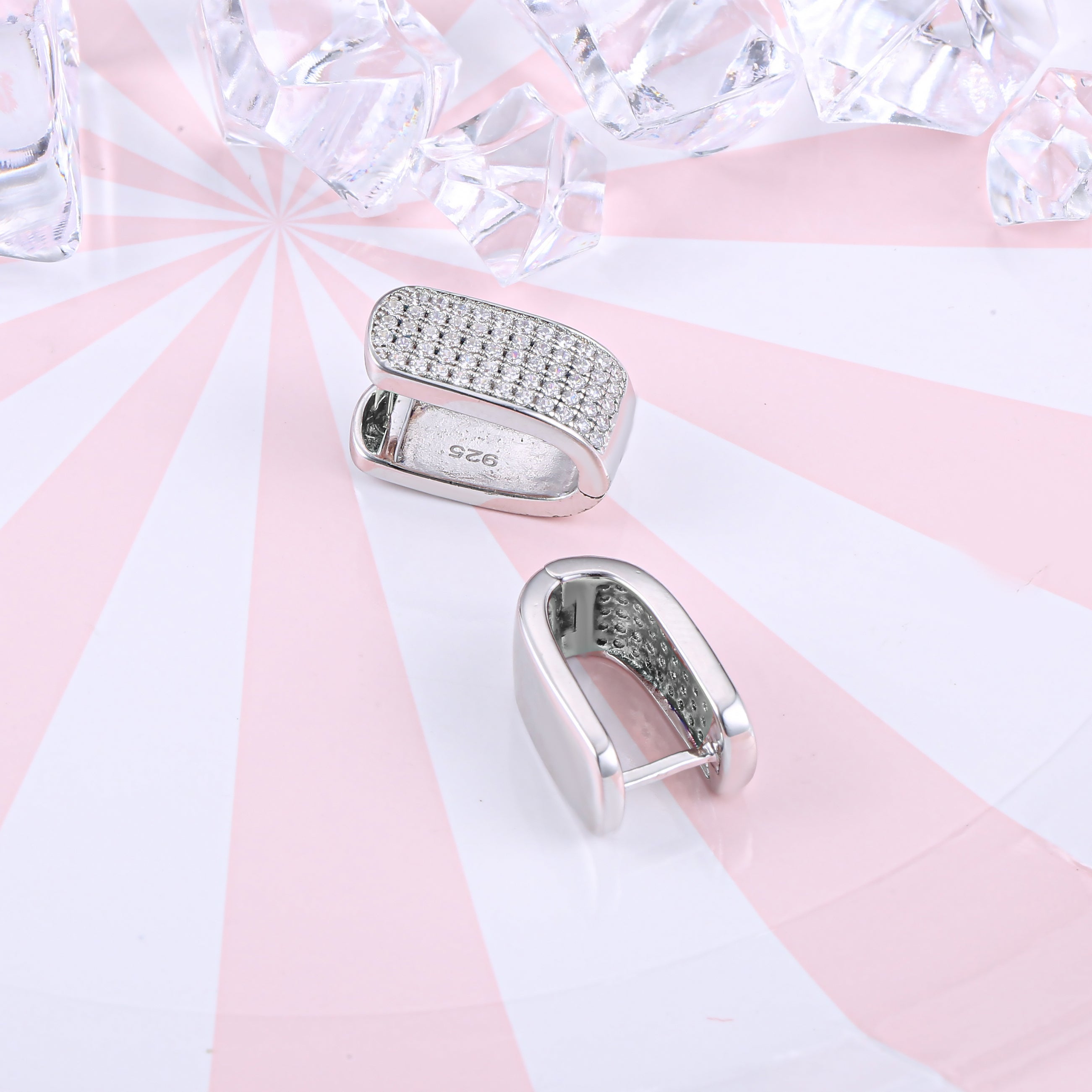 Elegant U shape pave stunning earrings made of 925 sterling silver with white sapphire accents and a white gold finish.