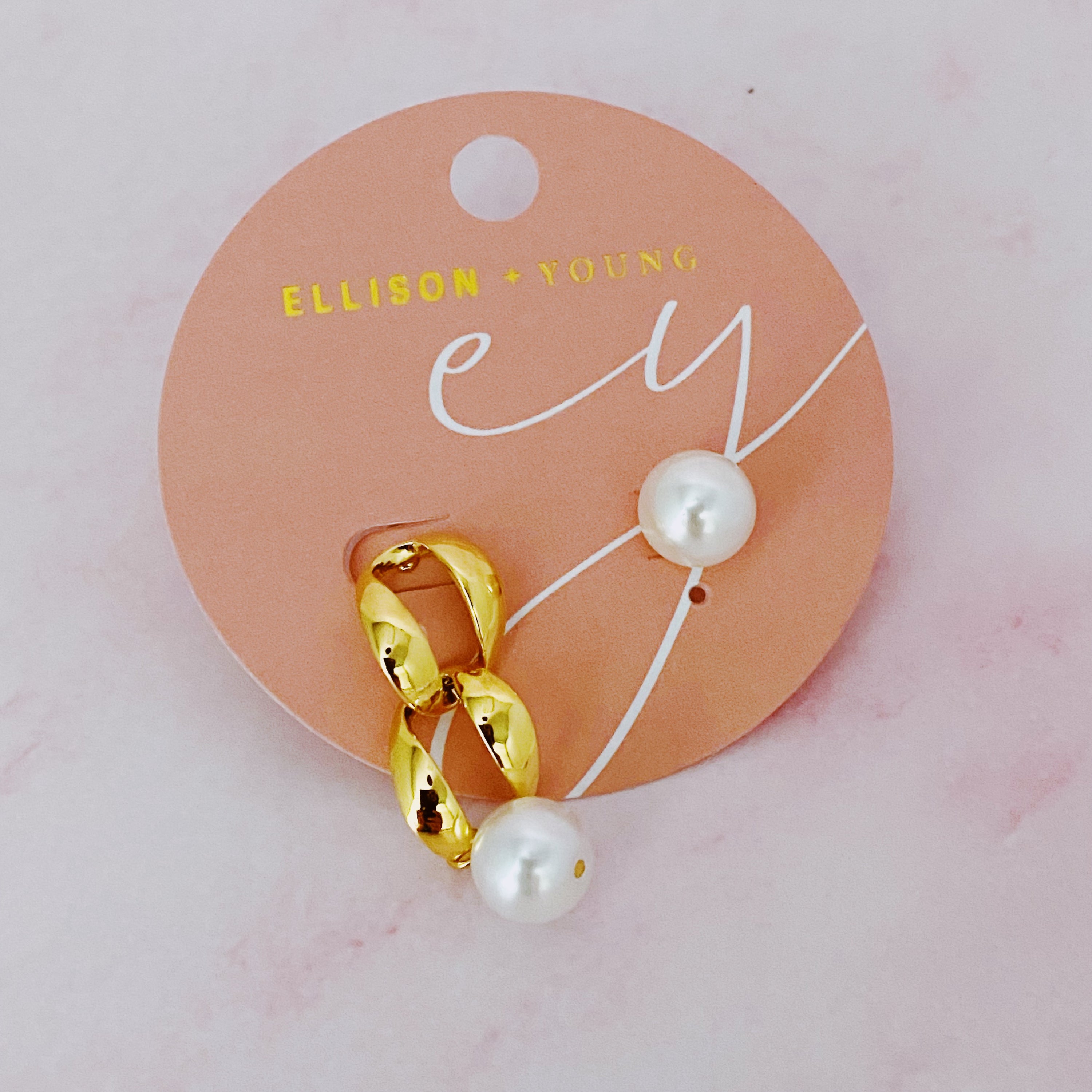 Stylish unbalanced hip pearl earrings featuring a dangling pearl and a matching stud, crafted from 18k gold plated stainless steel.