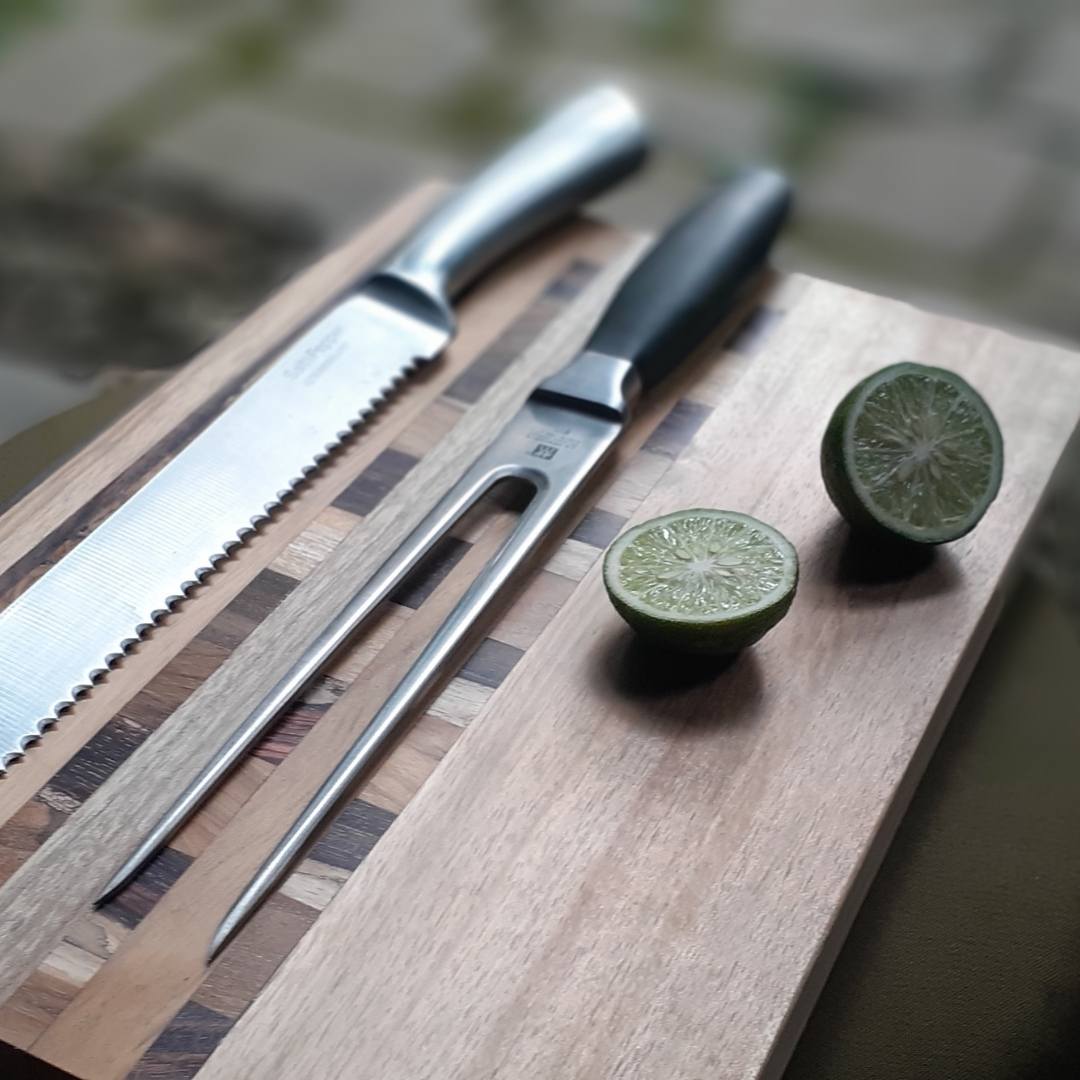 Upcycled End Grain Cutting Board made from reclaimed teak, rosewood, and jackfruit, showcasing unique patterns and craftsmanship.