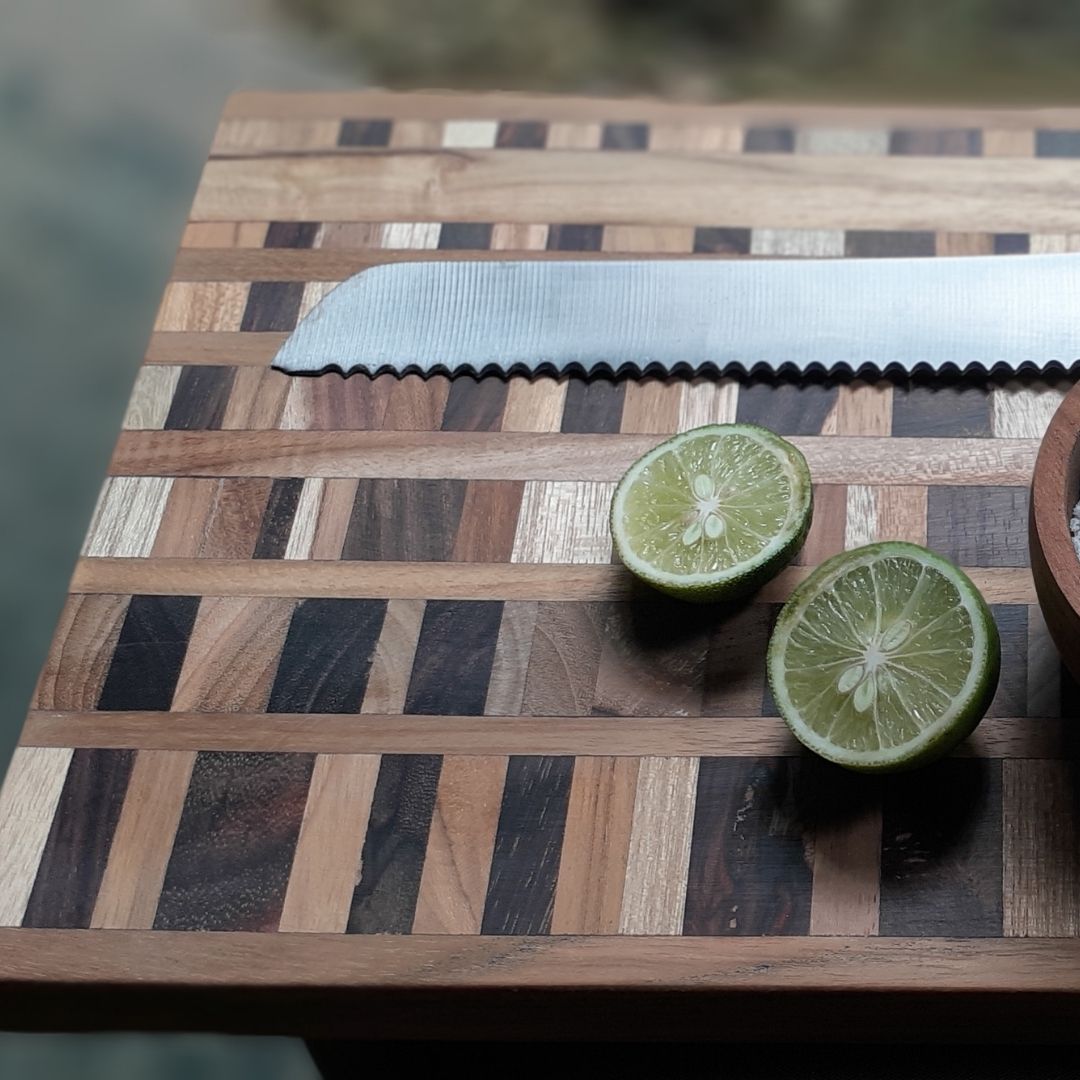 Upcycled End Grain Cutting Board made from reclaimed teak, rosewood, and jackfruit, showcasing unique patterns and craftsmanship.