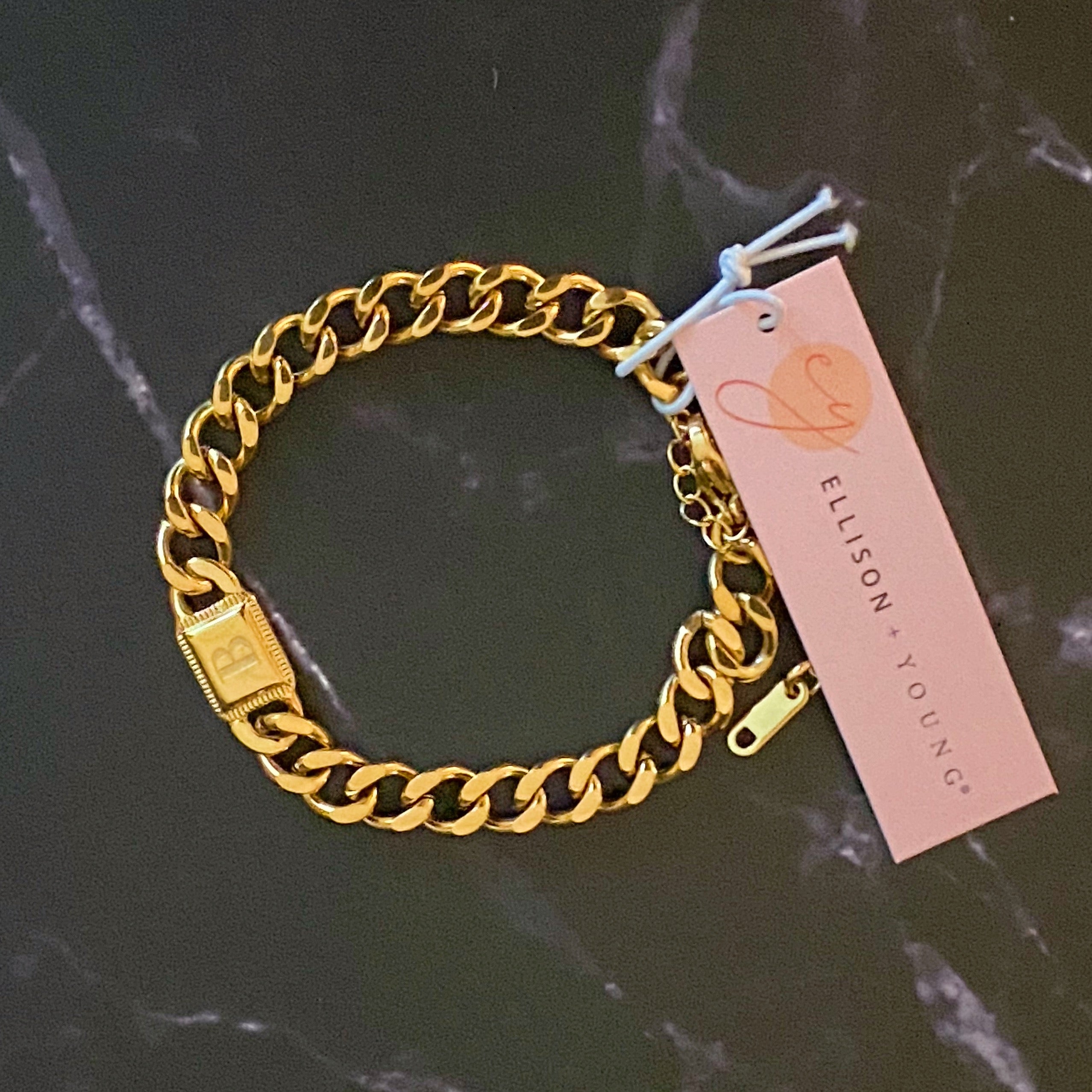 Uptown Cuban Chain Initial Bracelet featuring a personalized engraved initial tag, crafted from 18k gold plated stainless steel.