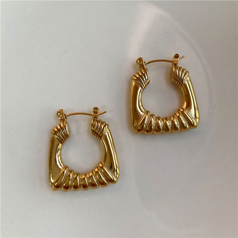 Valentina Square Statement Hoops in 18Kt yellow gold plated stainless steel, showcasing a unique square design with a textured finish.