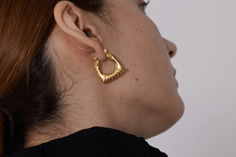 Valentina Square Statement Hoops in 18Kt yellow gold plated stainless steel, showcasing a unique square design with a textured finish.