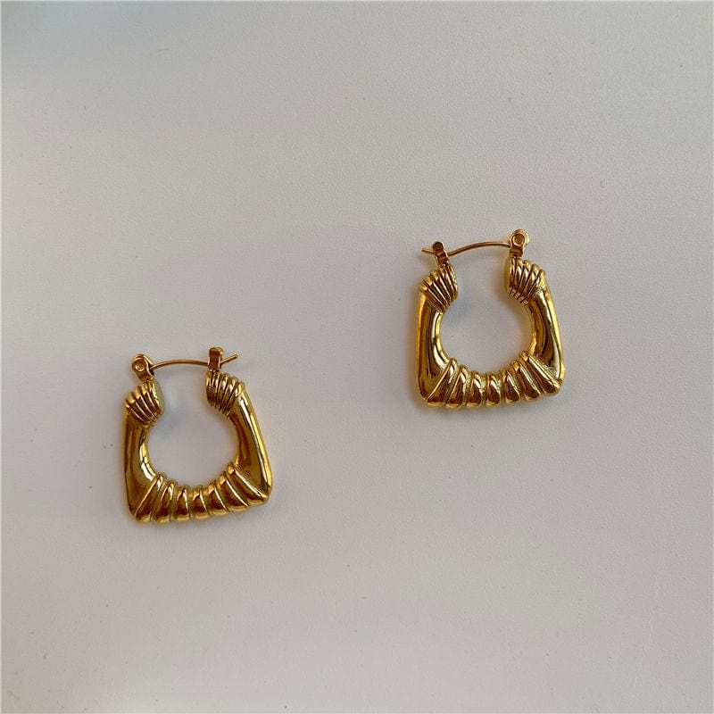 Valentina Square Statement Hoops in 18Kt yellow gold plated stainless steel, showcasing a unique square design with a textured finish.