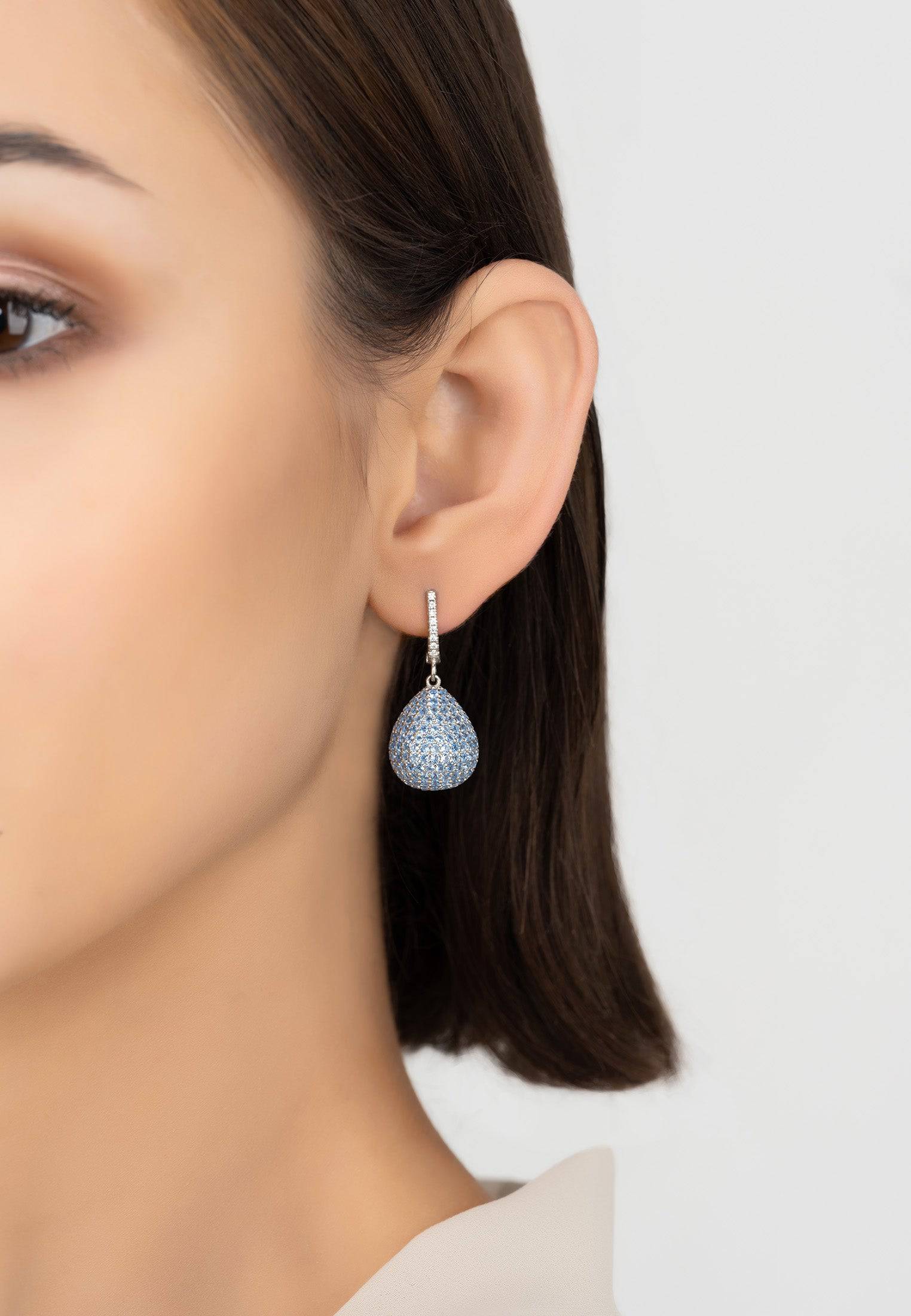 Valerie Pear Drop Gemstone Earrings in Silver with Ice Blue Cubic Zirconia, showcasing a brilliant-cut design and elegant creole fastening.