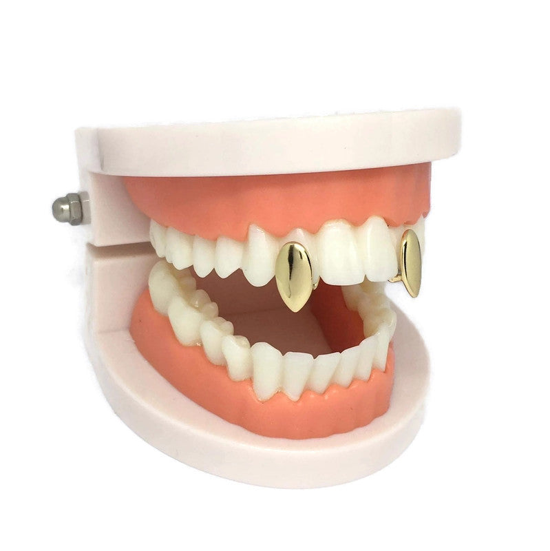 Vampire Fang Tooth Cap Set made of 18ct gold and sterling silver plated steel alloy, showcasing a pair of stylish fang caps.