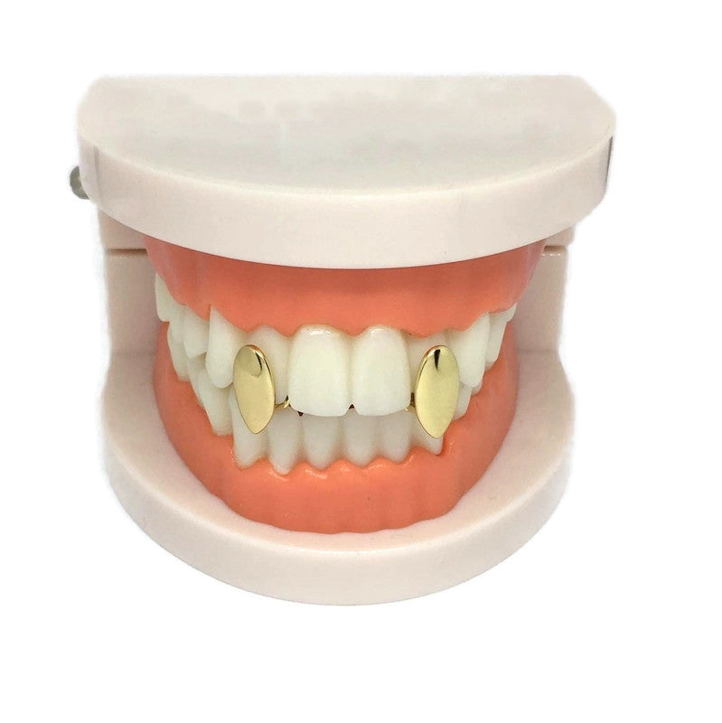 Vampire Fang Tooth Cap Set made of 18ct gold and sterling silver plated steel alloy, showcasing a pair of stylish fang caps.