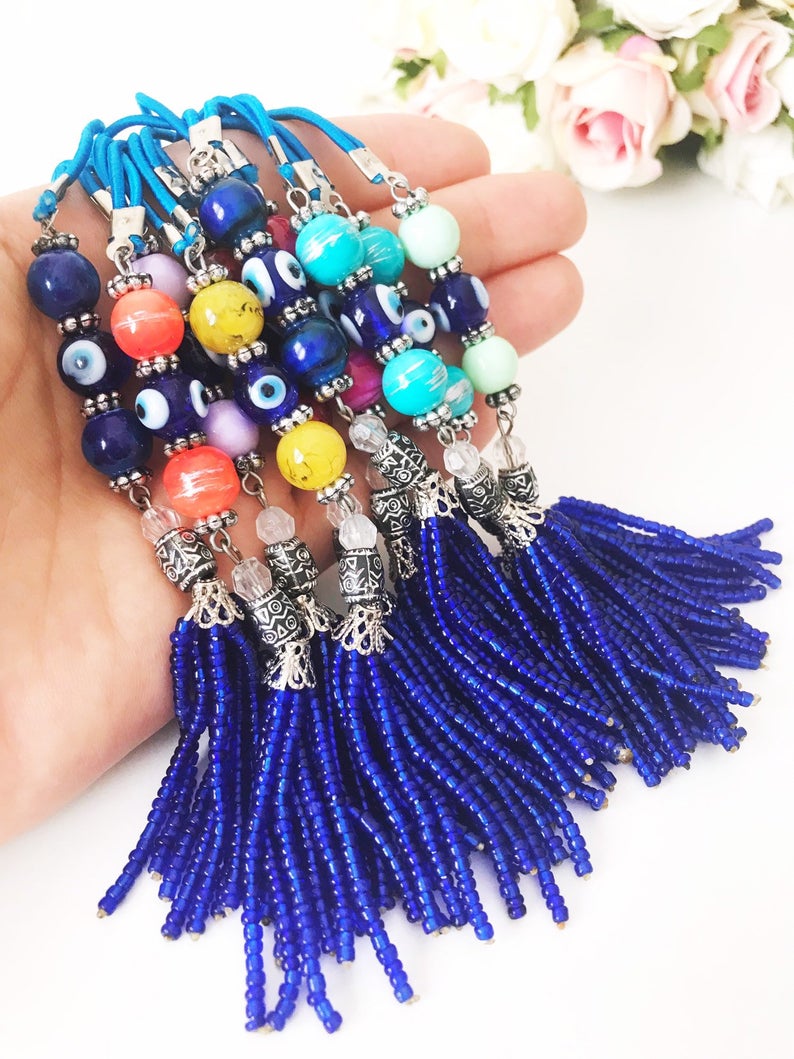 Handmade various color car rear mirror charm featuring a blue bead tassel and ceramic balls in mixed colors.