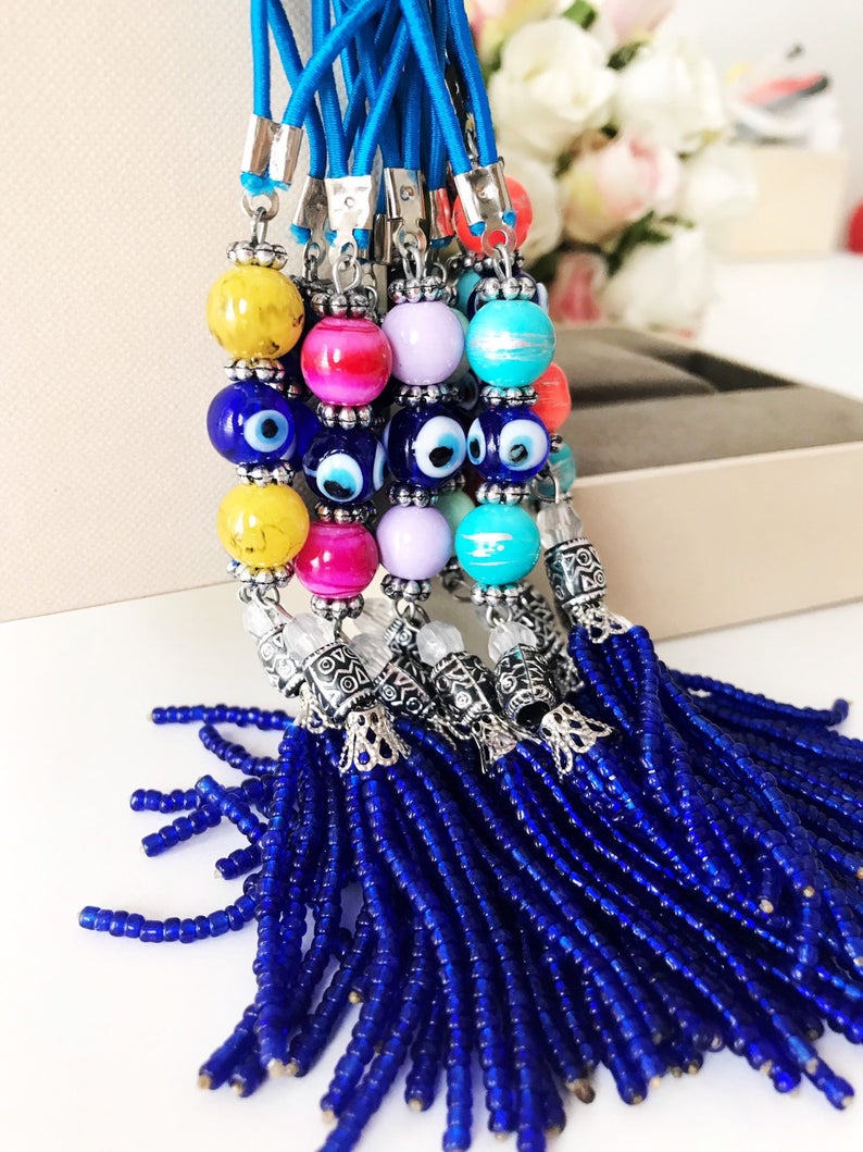 Handmade various color car rear mirror charm featuring a blue bead tassel and ceramic balls in mixed colors.