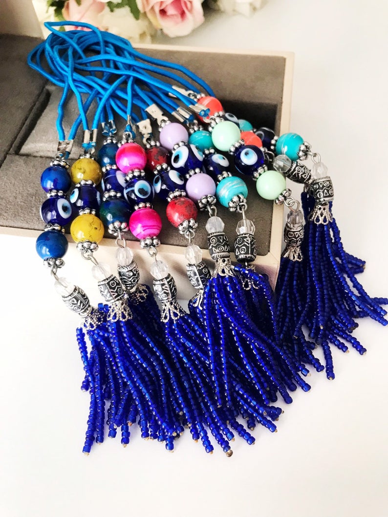 Handmade various color car rear mirror charm featuring a blue bead tassel and ceramic balls in mixed colors.