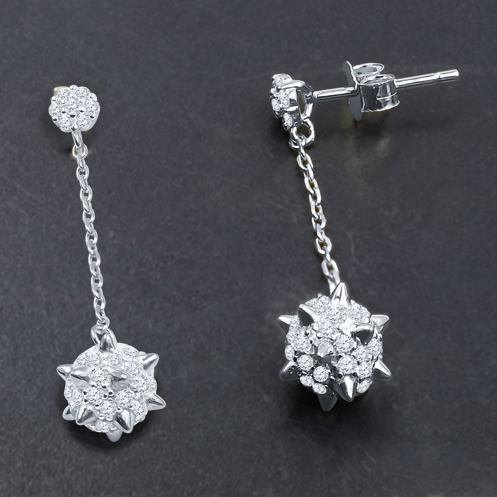 VASTY Silver Earrings featuring a unique textured design and sparkling Cubic Zircon stones, elegantly displayed.