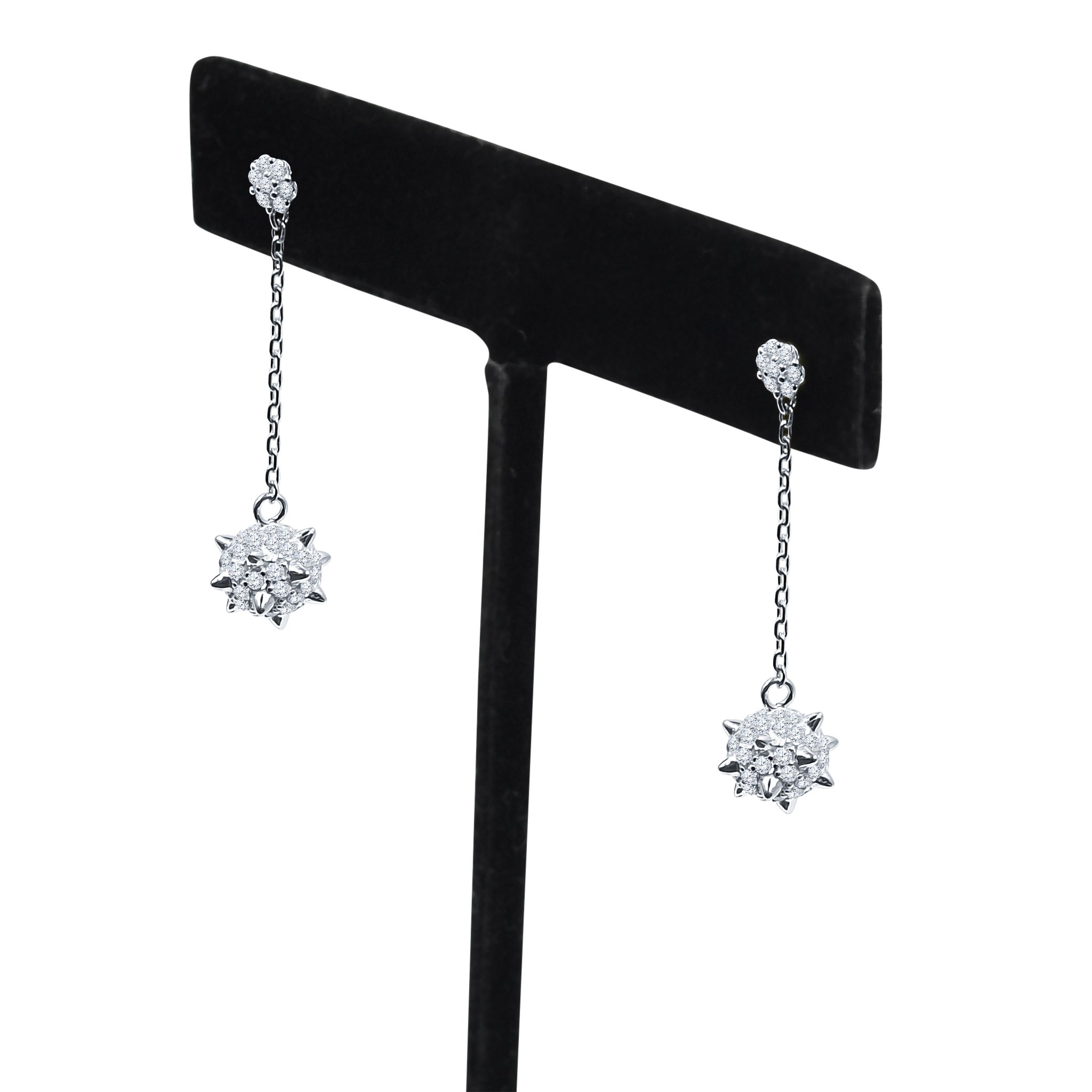 VASTY Silver Earrings featuring a unique textured design and sparkling Cubic Zircon stones, elegantly displayed.