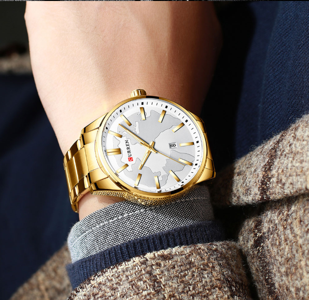 VERSATILITY CLASSIC METAL I 551072 watch featuring a unique map dial and golden polished metal strap, showcasing elegance and sophistication.