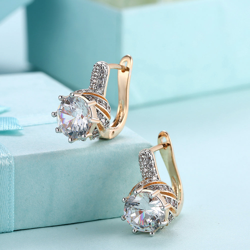 Elegant Vienna 1.00 Ct White Topaz Round Cut Huggie Earrings in 18K Gold Plated, showcasing their sparkling design and luxurious finish.