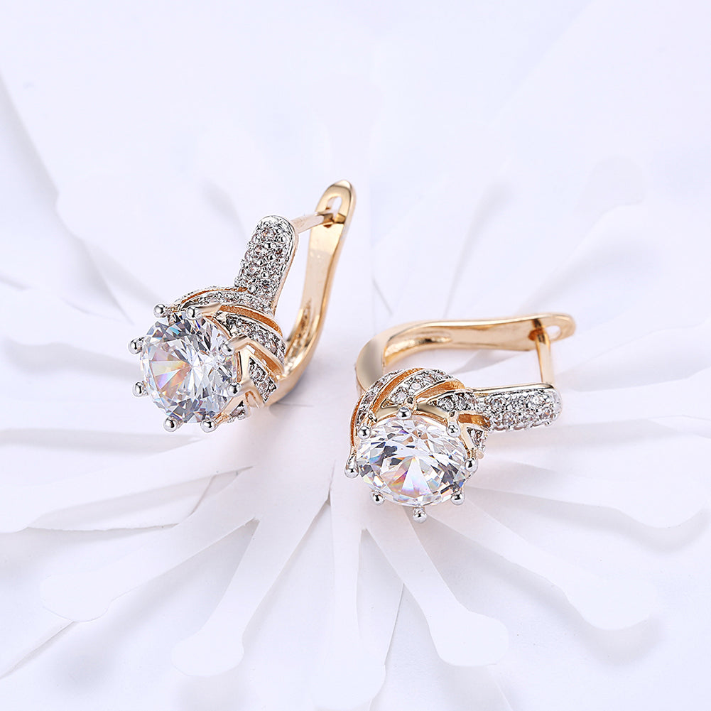 Elegant Vienna 1.00 Ct White Topaz Round Cut Huggie Earrings in 18K Gold Plated, showcasing their sparkling design and luxurious finish.