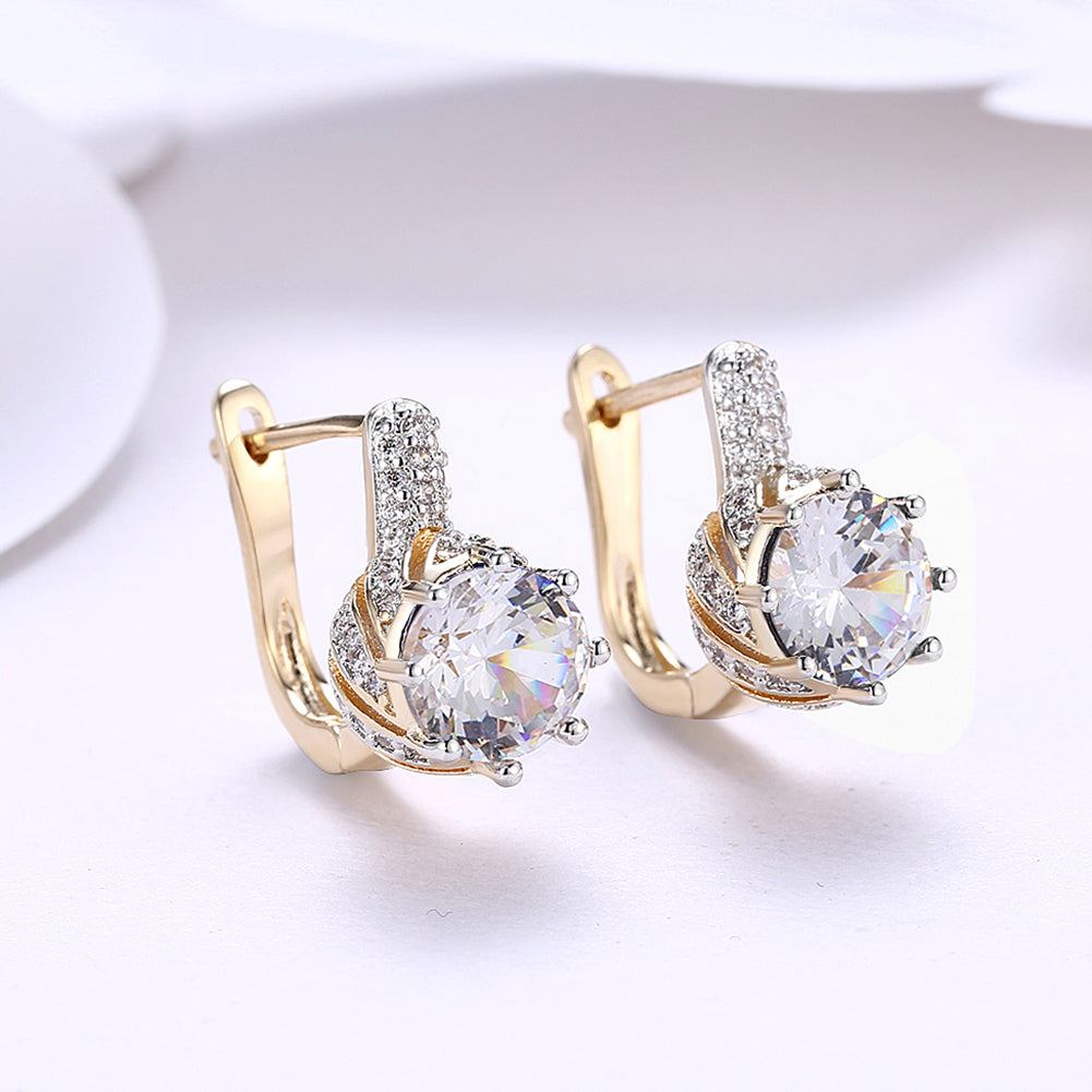 Elegant Vienna 1.00 Ct White Topaz Round Cut Huggie Earrings in 18K Gold Plated, showcasing their sparkling design and luxurious finish.