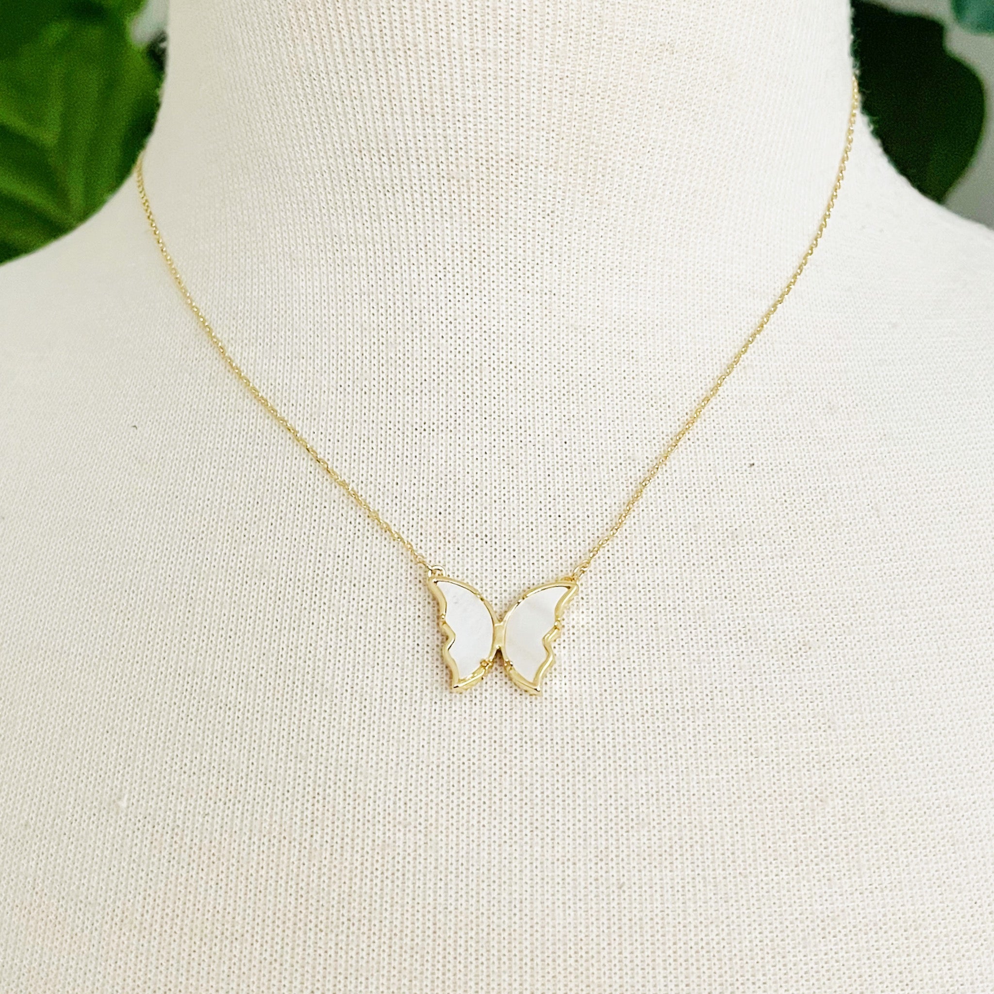 Vintage Glam Reversible Butterfly Necklace featuring an intricate butterfly pendant, 18k gold plated chain, and adjustable length.