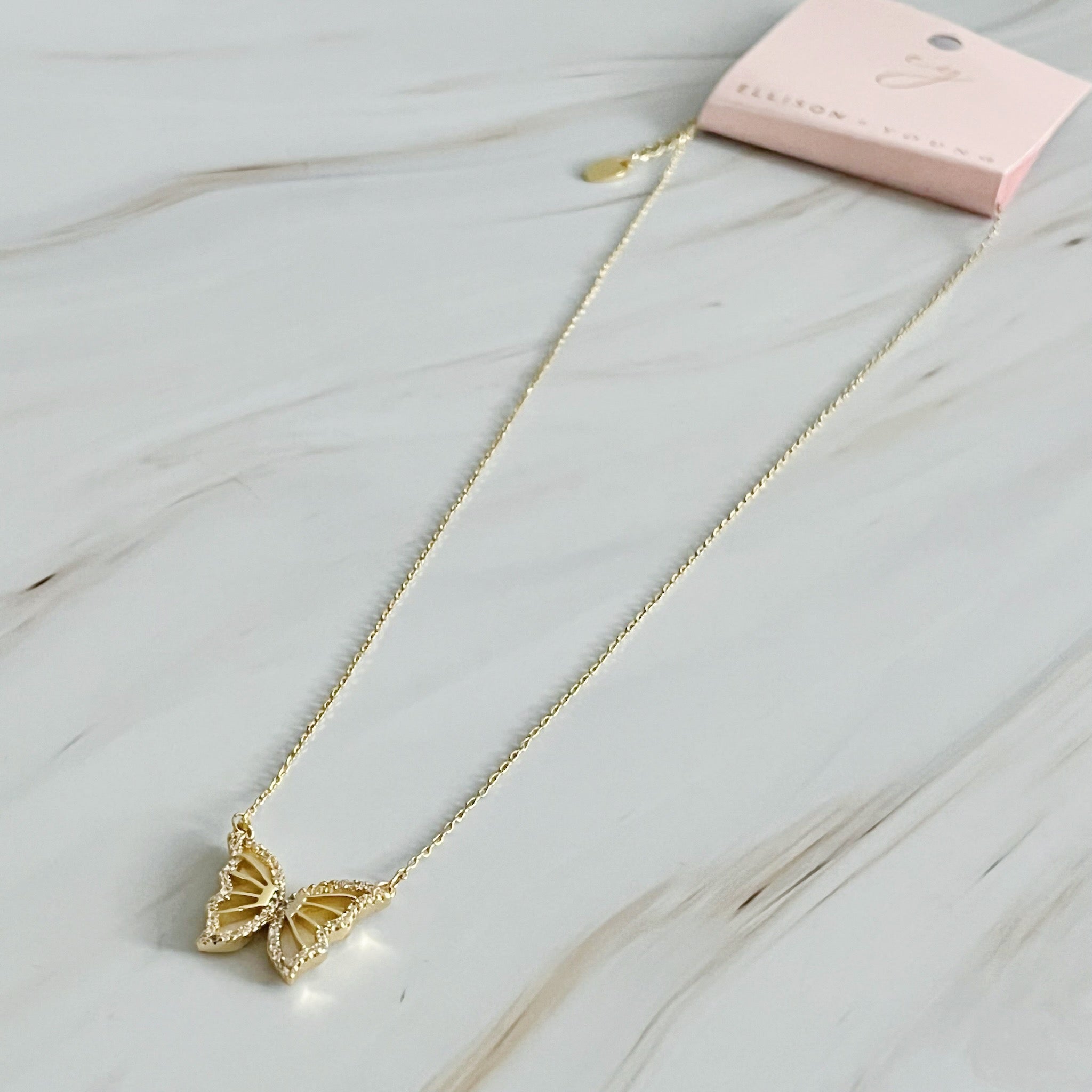 Vintage Glam Reversible Butterfly Necklace featuring an intricate butterfly pendant, 18k gold plated chain, and adjustable length.