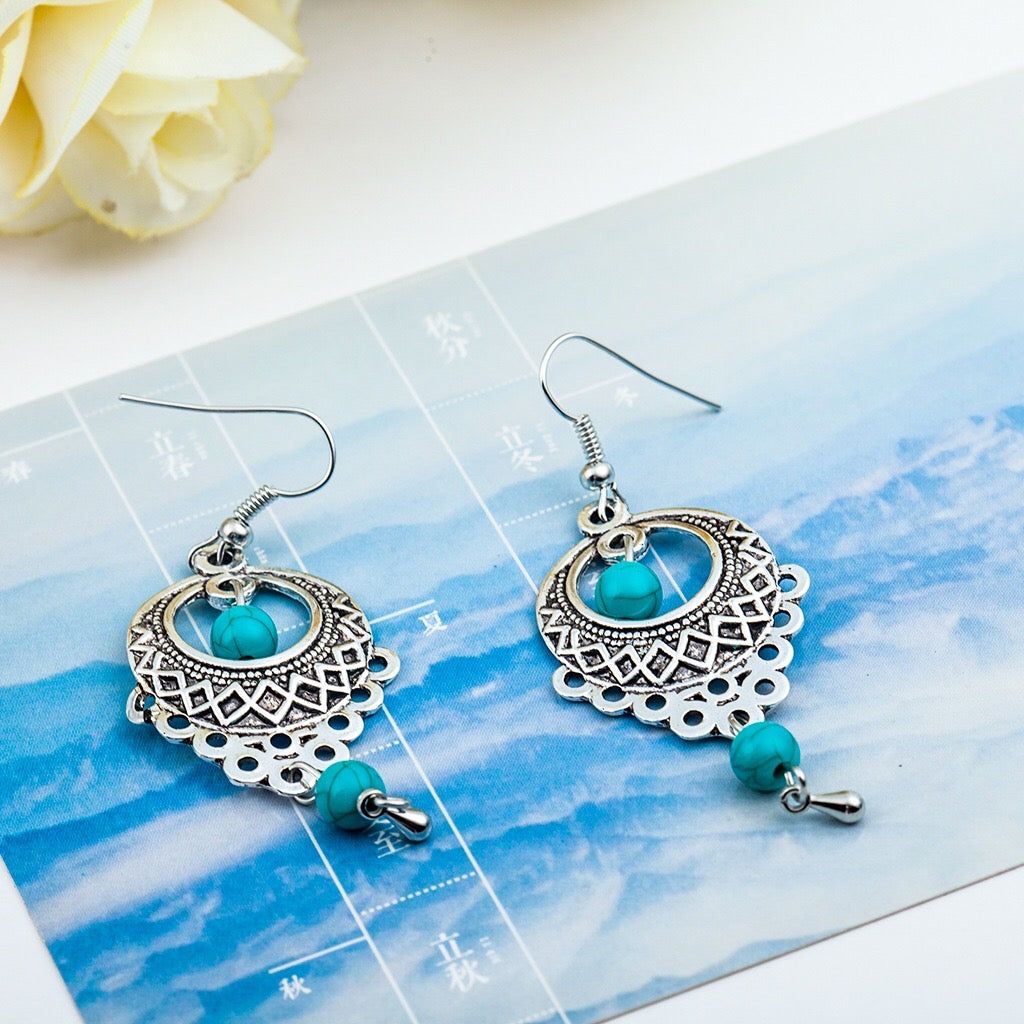 Elegant vintage turquoise slinky drop earrings made from alloy and 925 silver, featuring sparkling rhinestones.