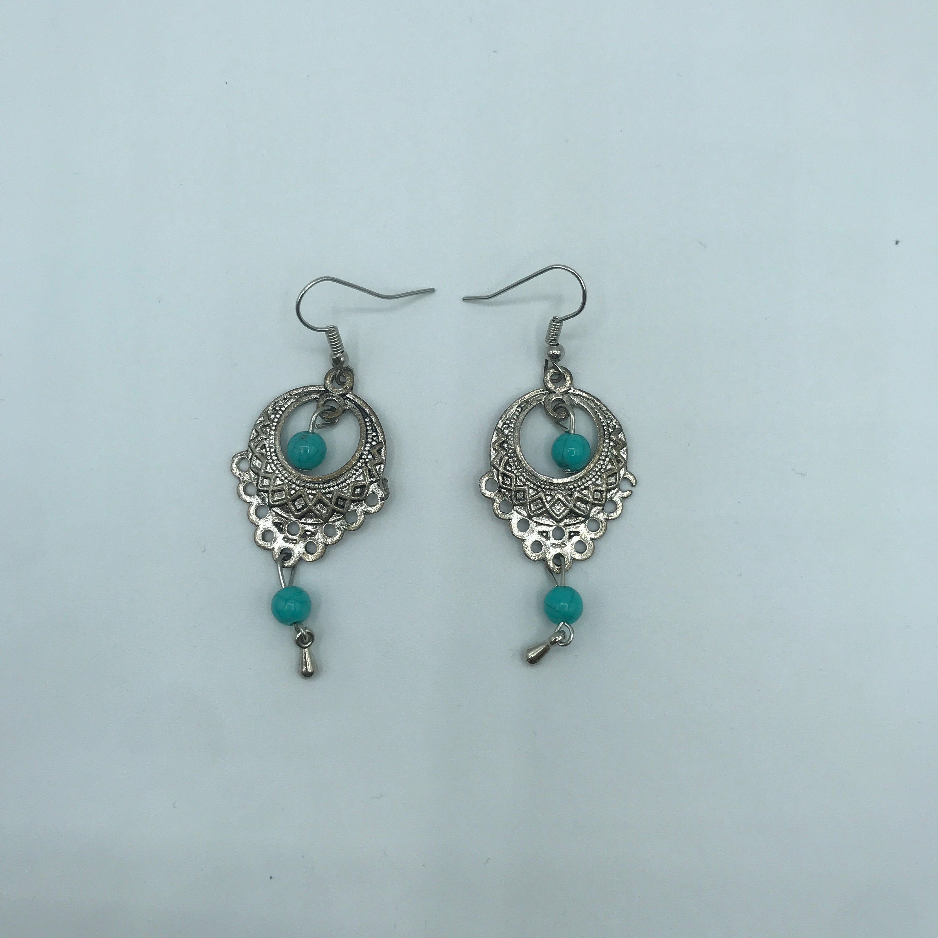 Elegant vintage turquoise slinky drop earrings made from alloy and 925 silver, featuring sparkling rhinestones.