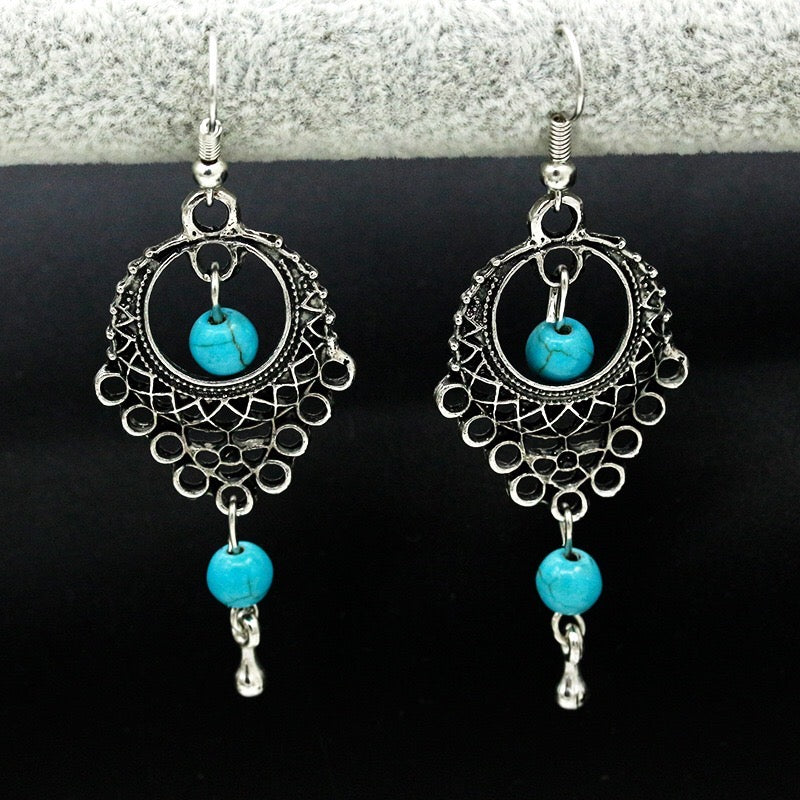 Elegant vintage turquoise slinky drop earrings made from alloy and 925 silver, featuring sparkling rhinestones.