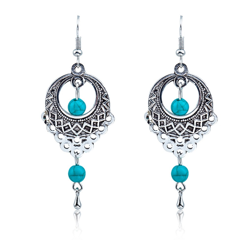 Elegant vintage turquoise slinky drop earrings made from alloy and 925 silver, featuring sparkling rhinestones.