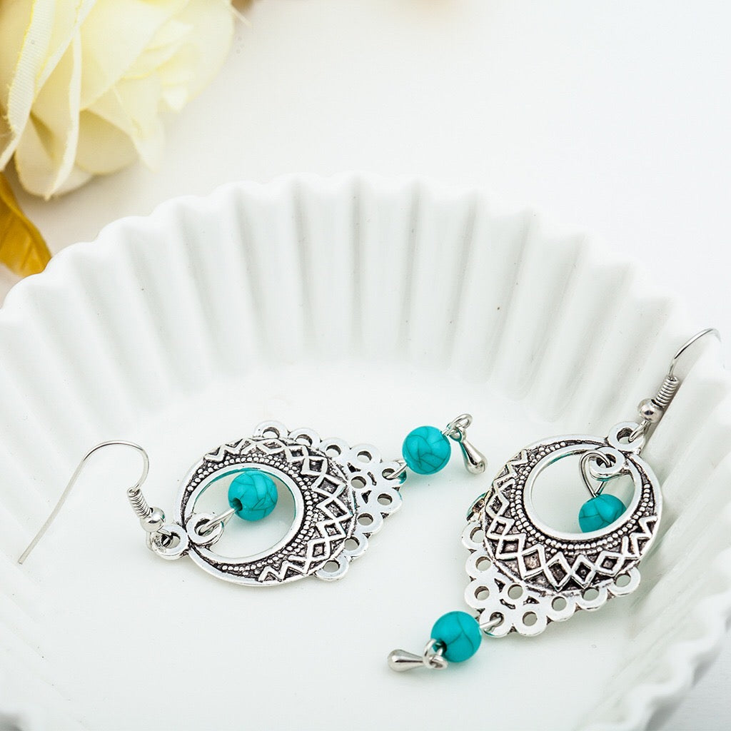 Elegant vintage turquoise slinky drop earrings made from alloy and 925 silver, featuring sparkling rhinestones.