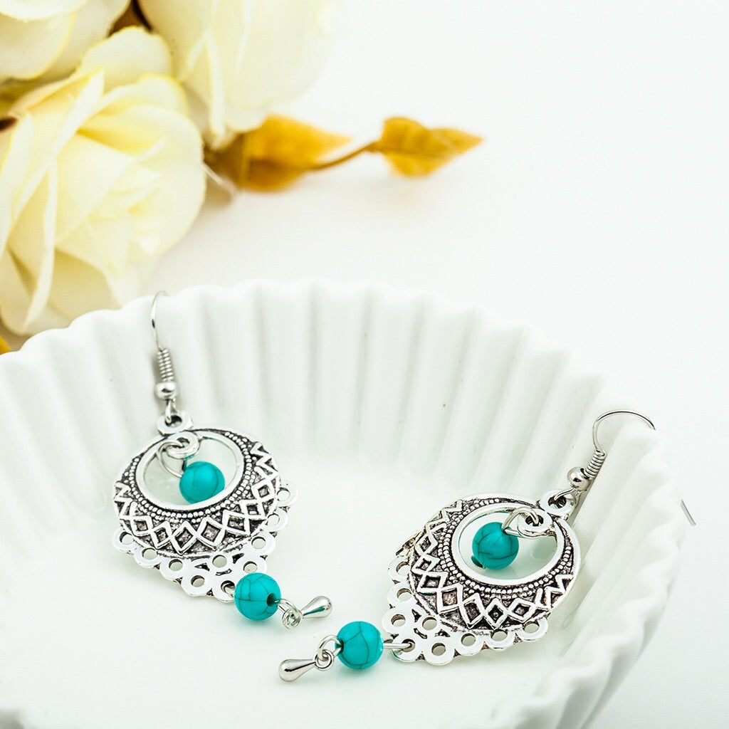 Elegant vintage turquoise slinky drop earrings made from alloy and 925 silver, featuring sparkling rhinestones.