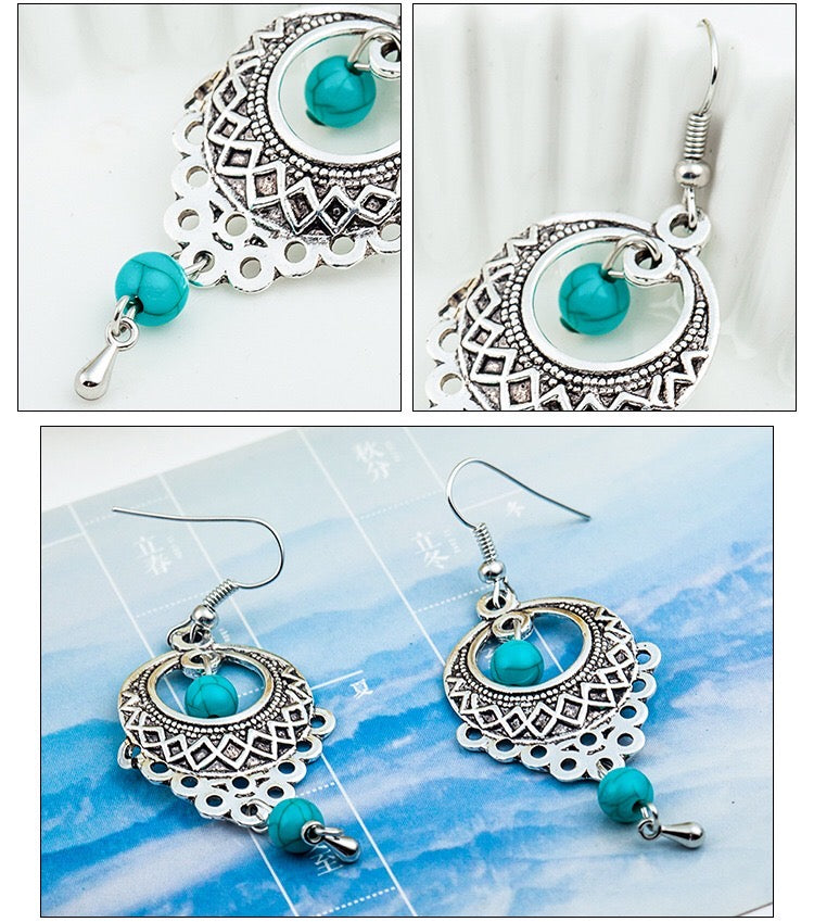 Elegant vintage turquoise slinky drop earrings made from alloy and 925 silver, featuring sparkling rhinestones.