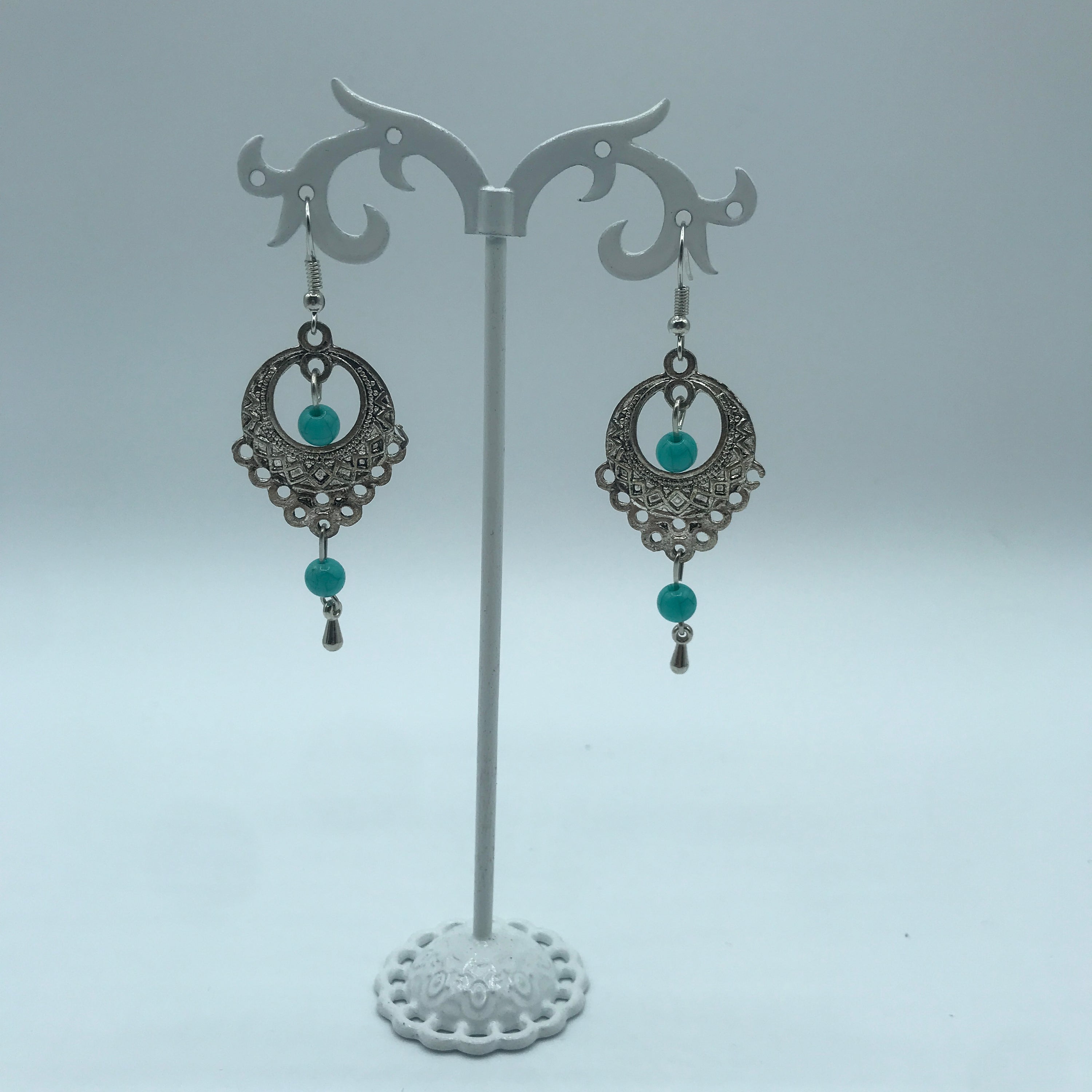 Elegant vintage turquoise slinky drop earrings made from alloy and 925 silver, featuring sparkling rhinestones.