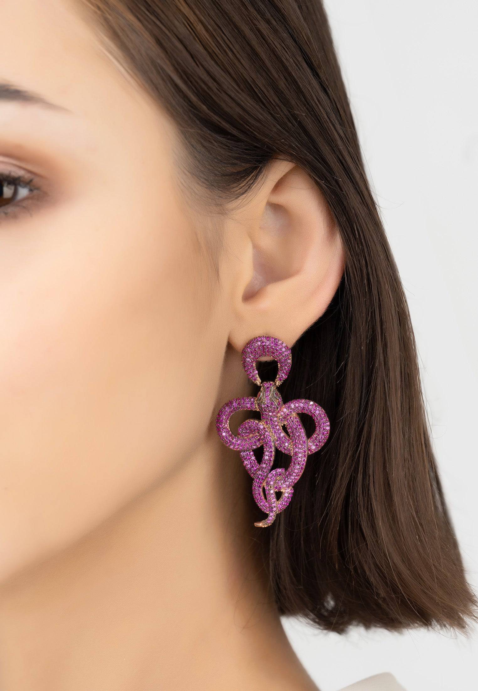 Viper Snake Drop Earrings in rosegold featuring ruby cubic zirconia, designed as a curled snake for a chic look.