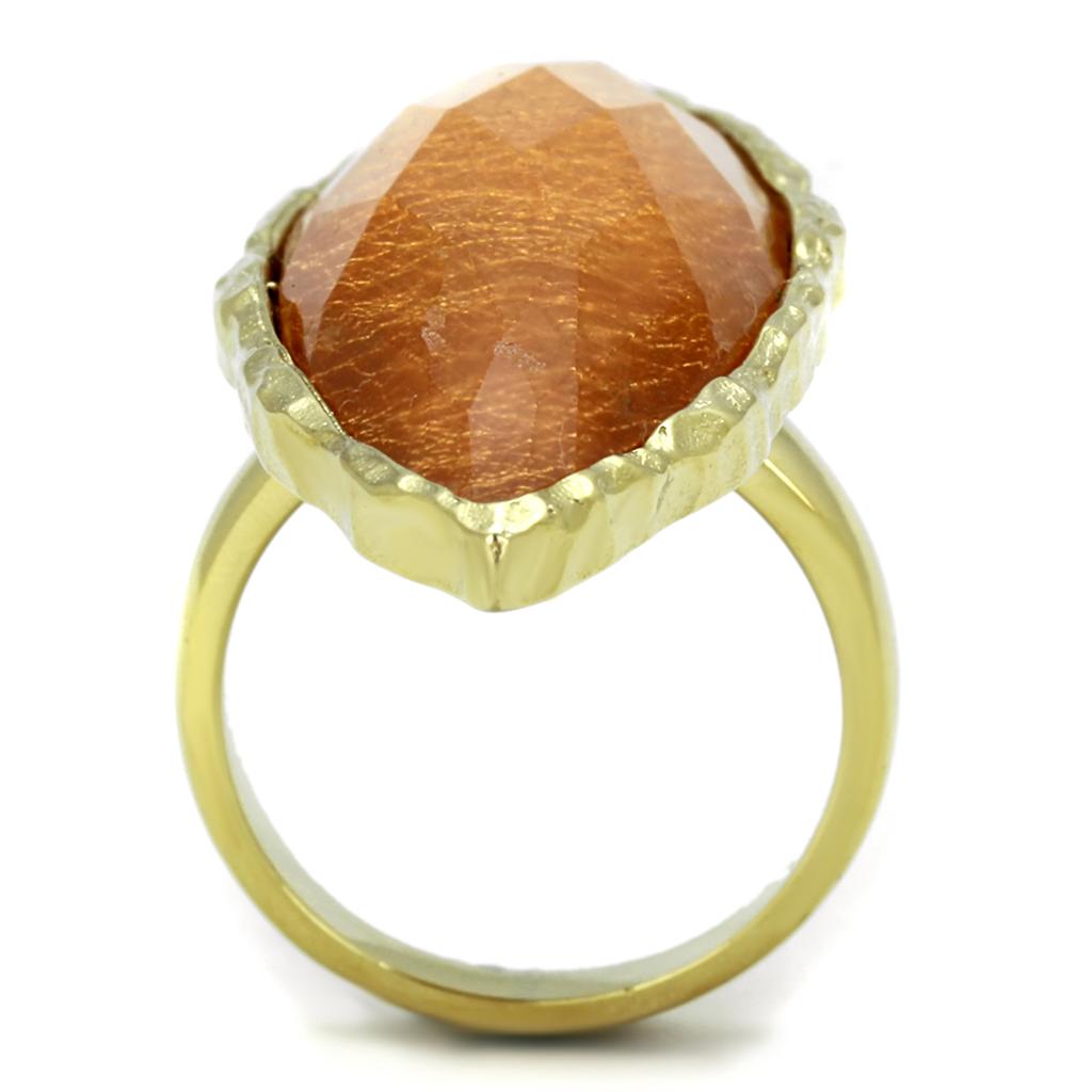 VL120 IP Gold Stainless Steel Ring featuring a vibrant synthetic orange stone, showcasing its elegant design and luxurious finish.