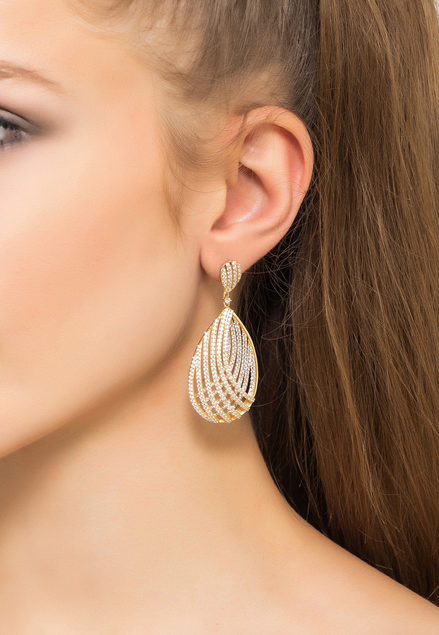 Elegant Vortex Teardrop Earrings in Rosegold, handcrafted from sterling silver with sparkling zirconia details.