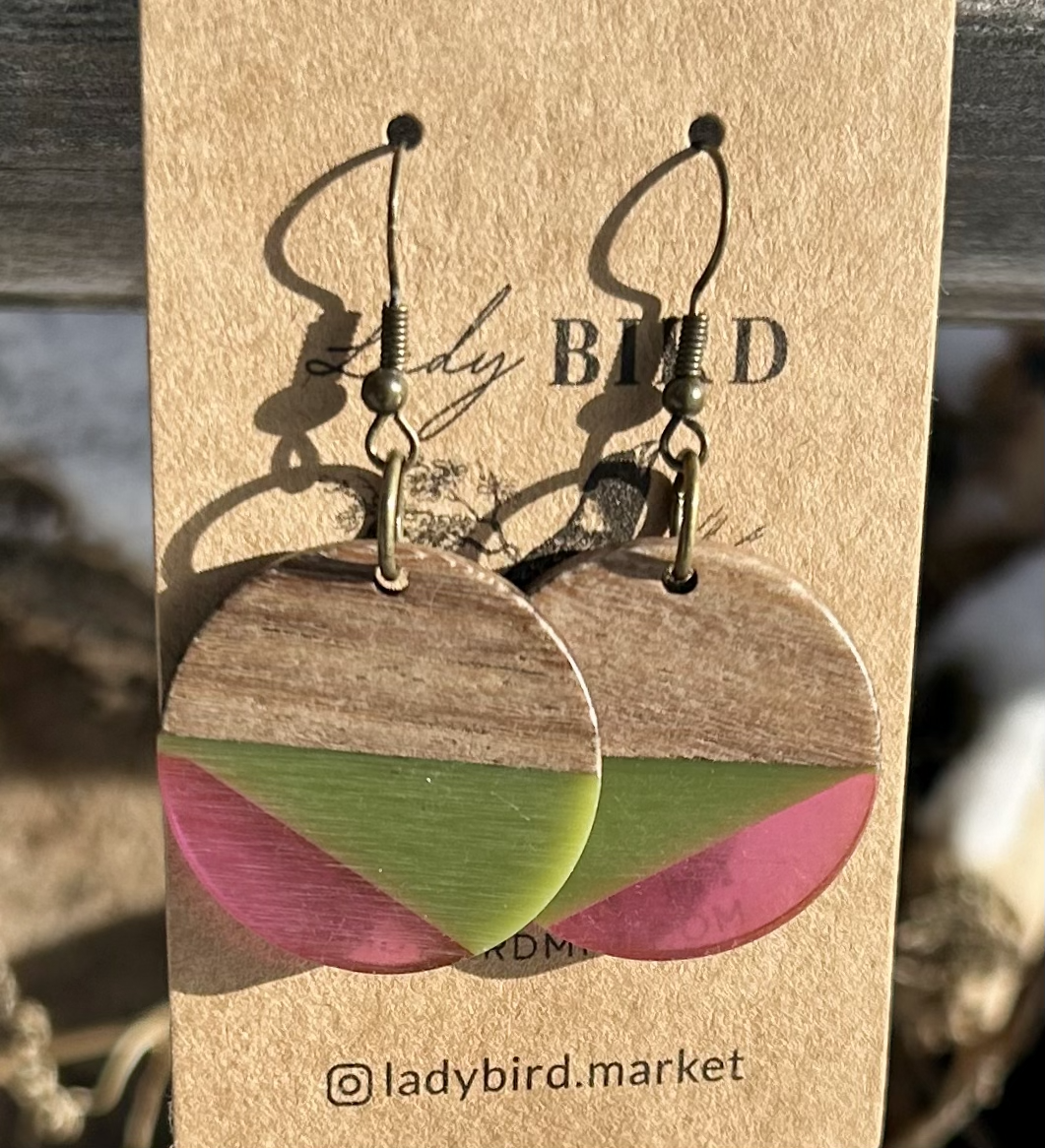 Walnut wood circle earrings with army green and purple resin stripes, showcasing a unique and earthy design.