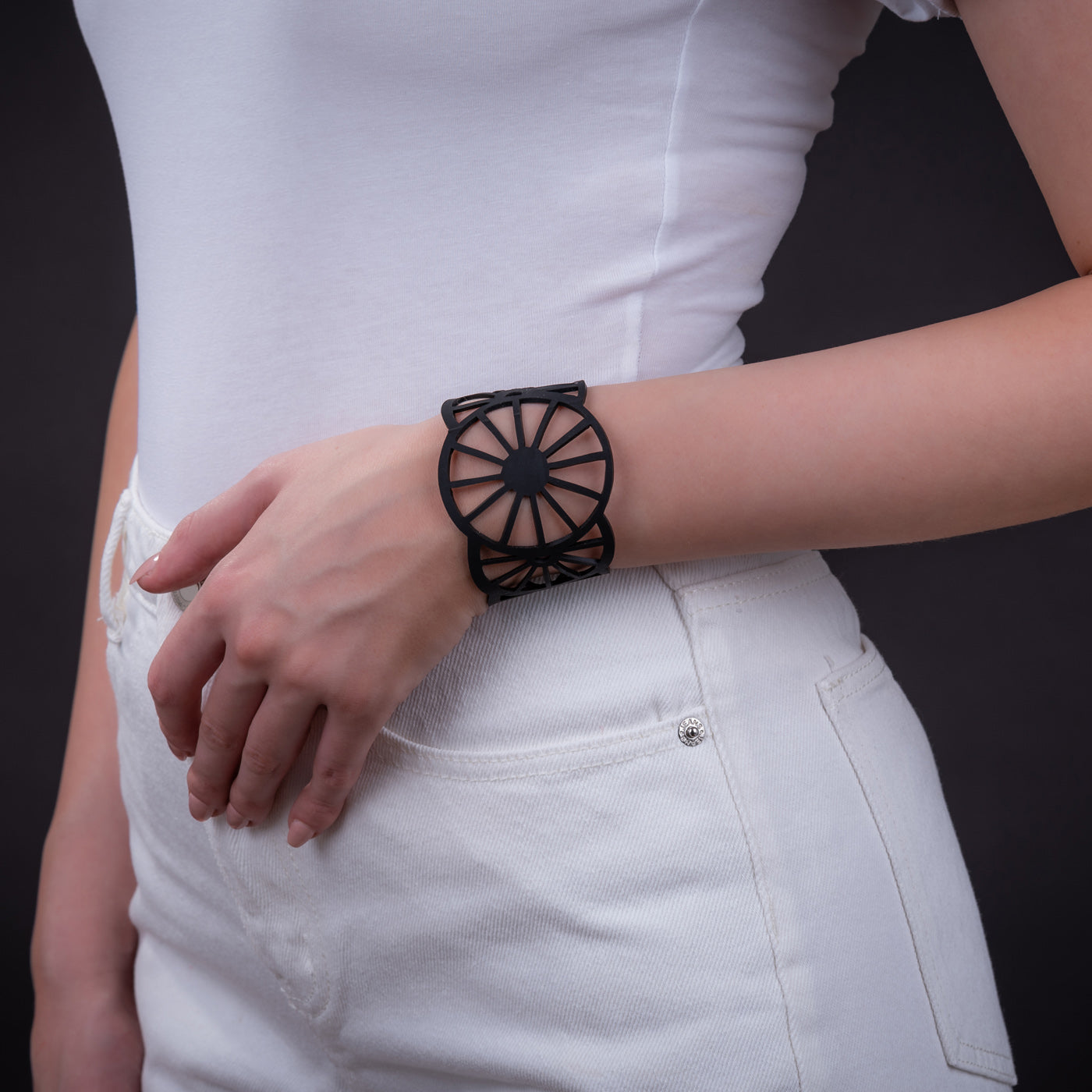 A stylish Water Wheel Rubber Bracelet made from recycled rubber, featuring intricate detailing and a comfortable fit.