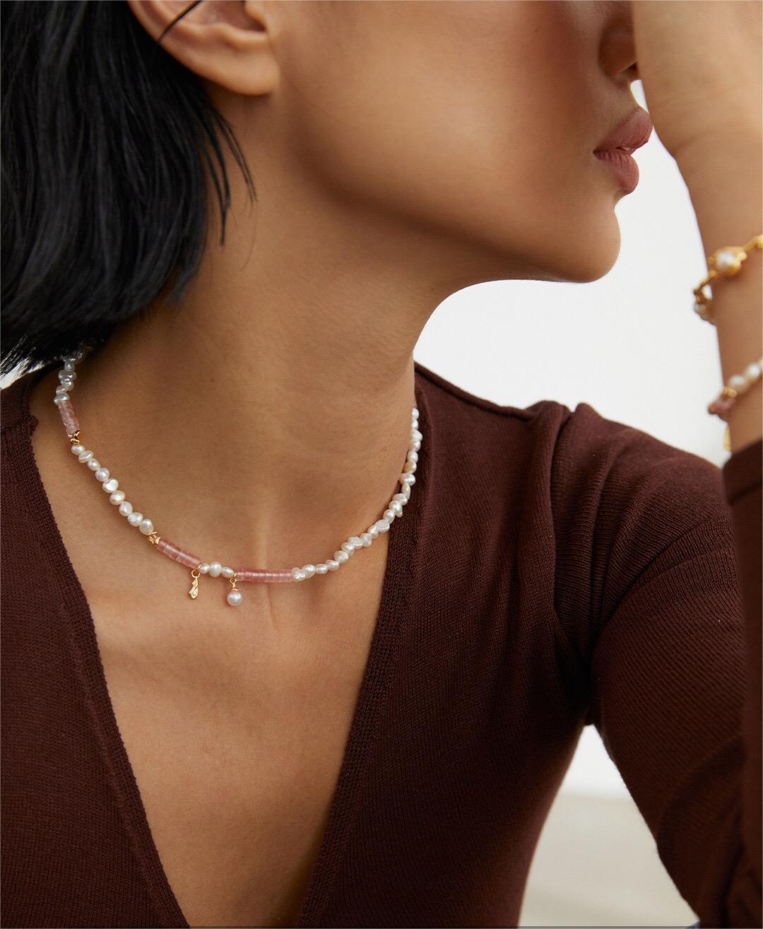 A stunning Watermelon Ruby Freshwater Pearl Necklace featuring natural pearls and gold vermeil, elegantly displayed on a soft background.