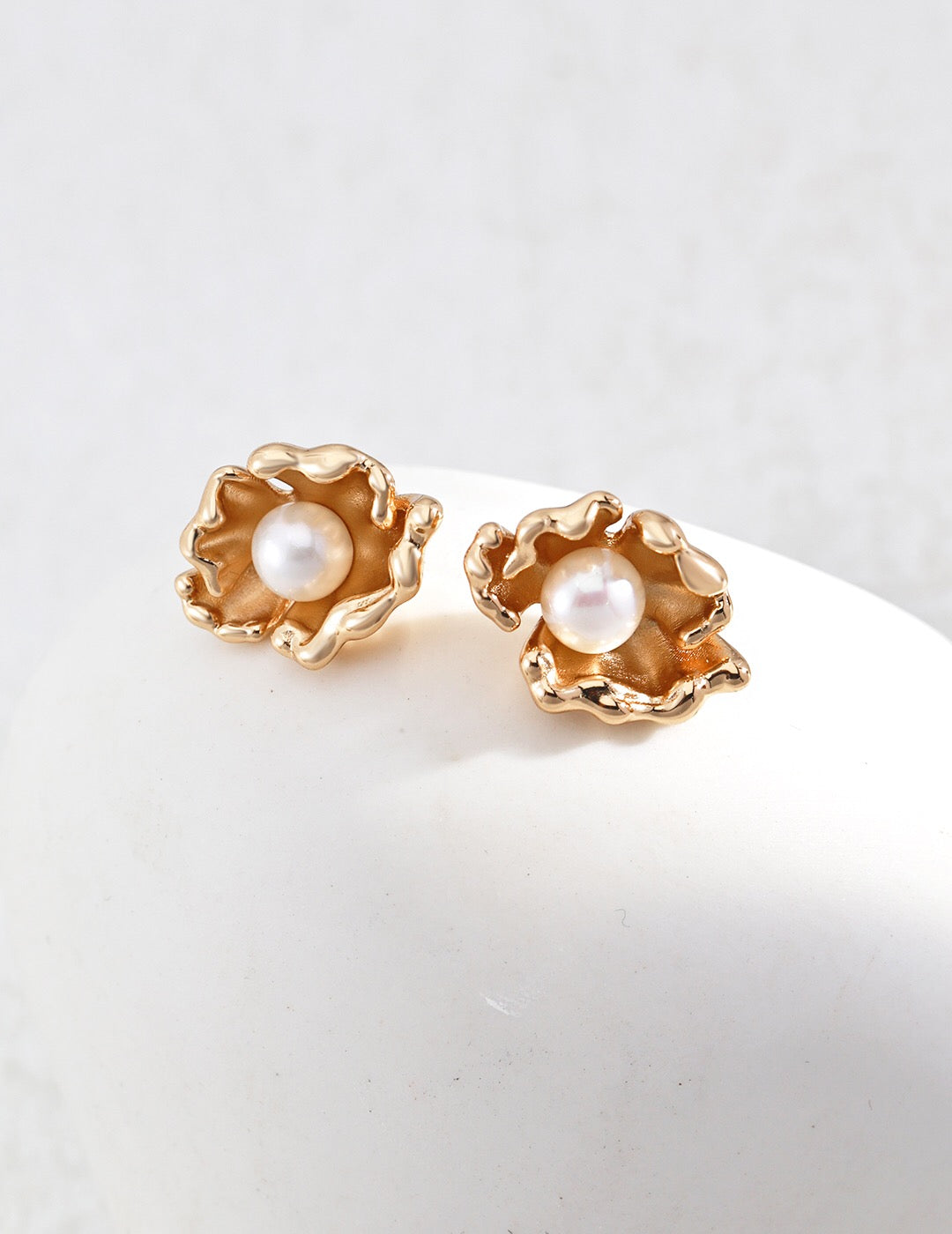 Elegant Wave Design Pearl Earrings featuring natural pearls and gold vermeil, showcasing a unique wave pattern.