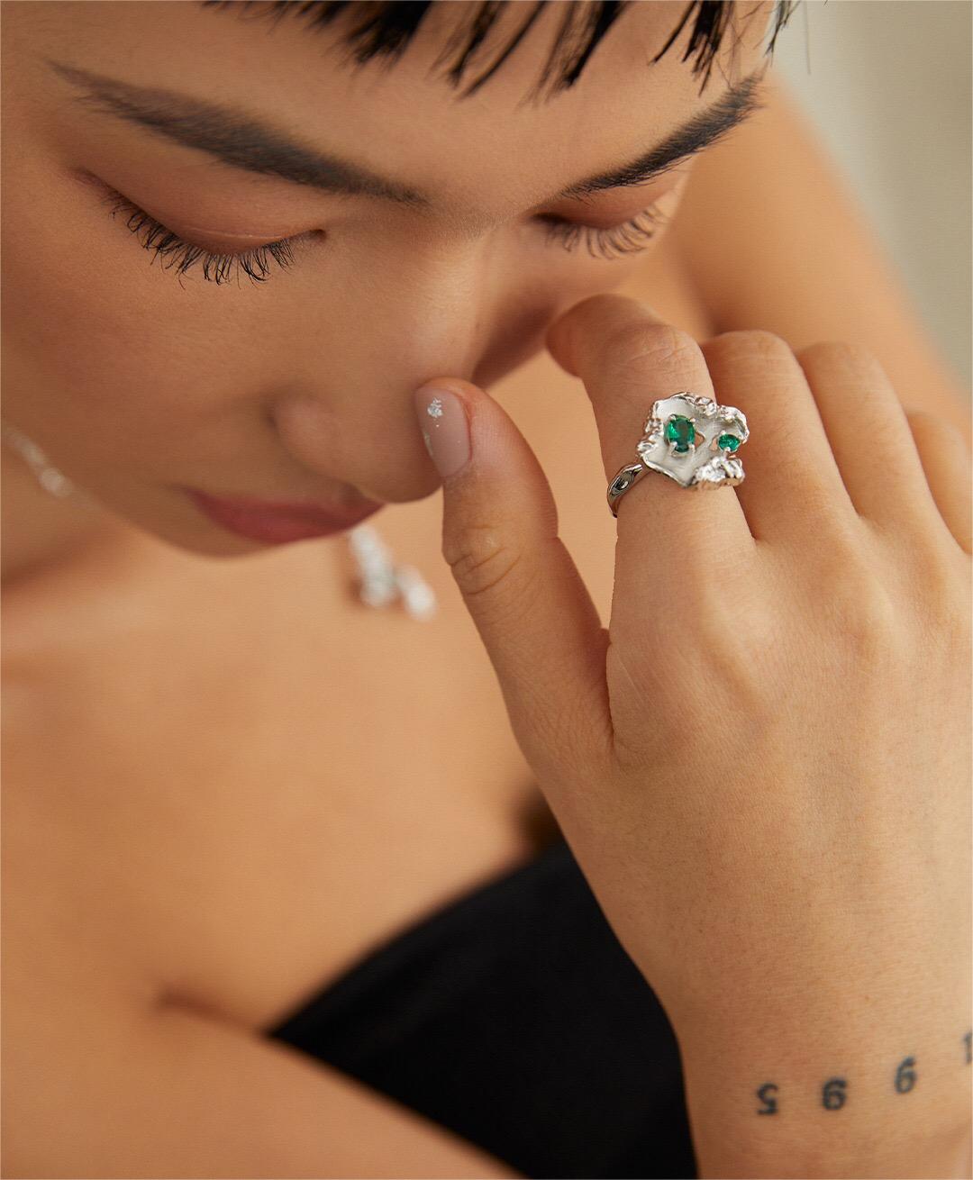 Wave Emerald Zircon Ring featuring gold vermeil and adjustable design, showcasing sparkling zircon stones in a unique wave pattern.