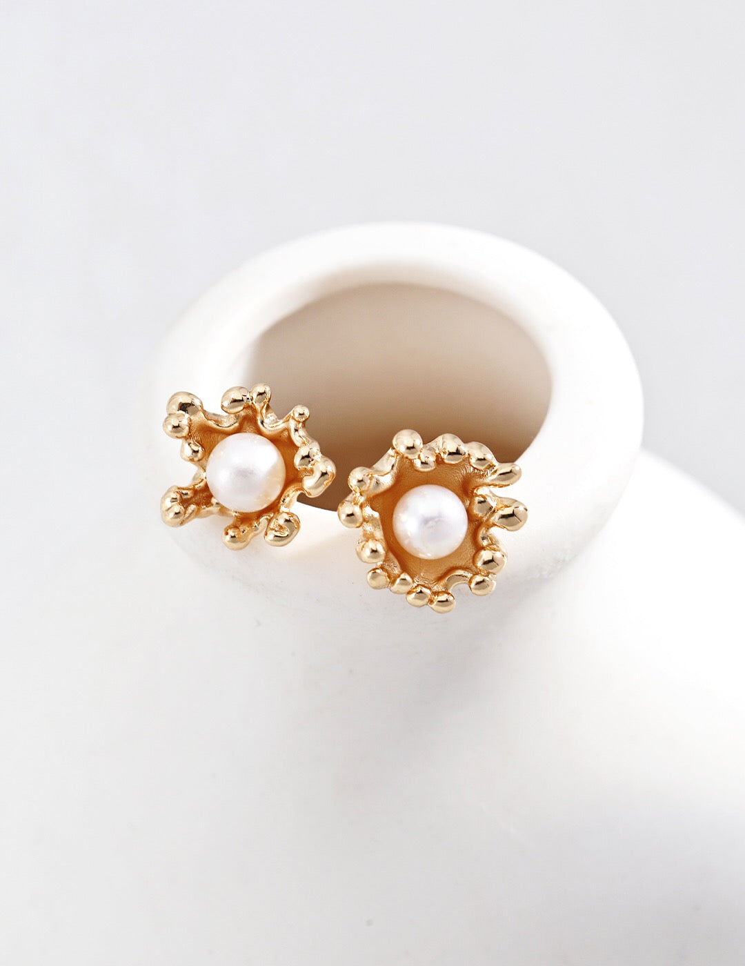 Elegant Wave Flowing Pearl Earrings featuring natural pearls and gold vermeil, showcasing a unique design and luxurious finish.