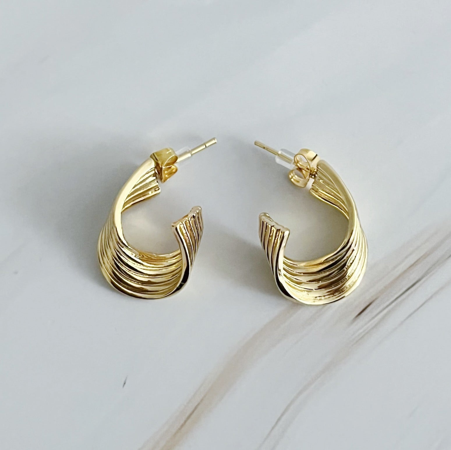 Elegant Wave Twisted Hoop Earrings in 18k gold plated brass with intricate wave design, perfect for any occasion.