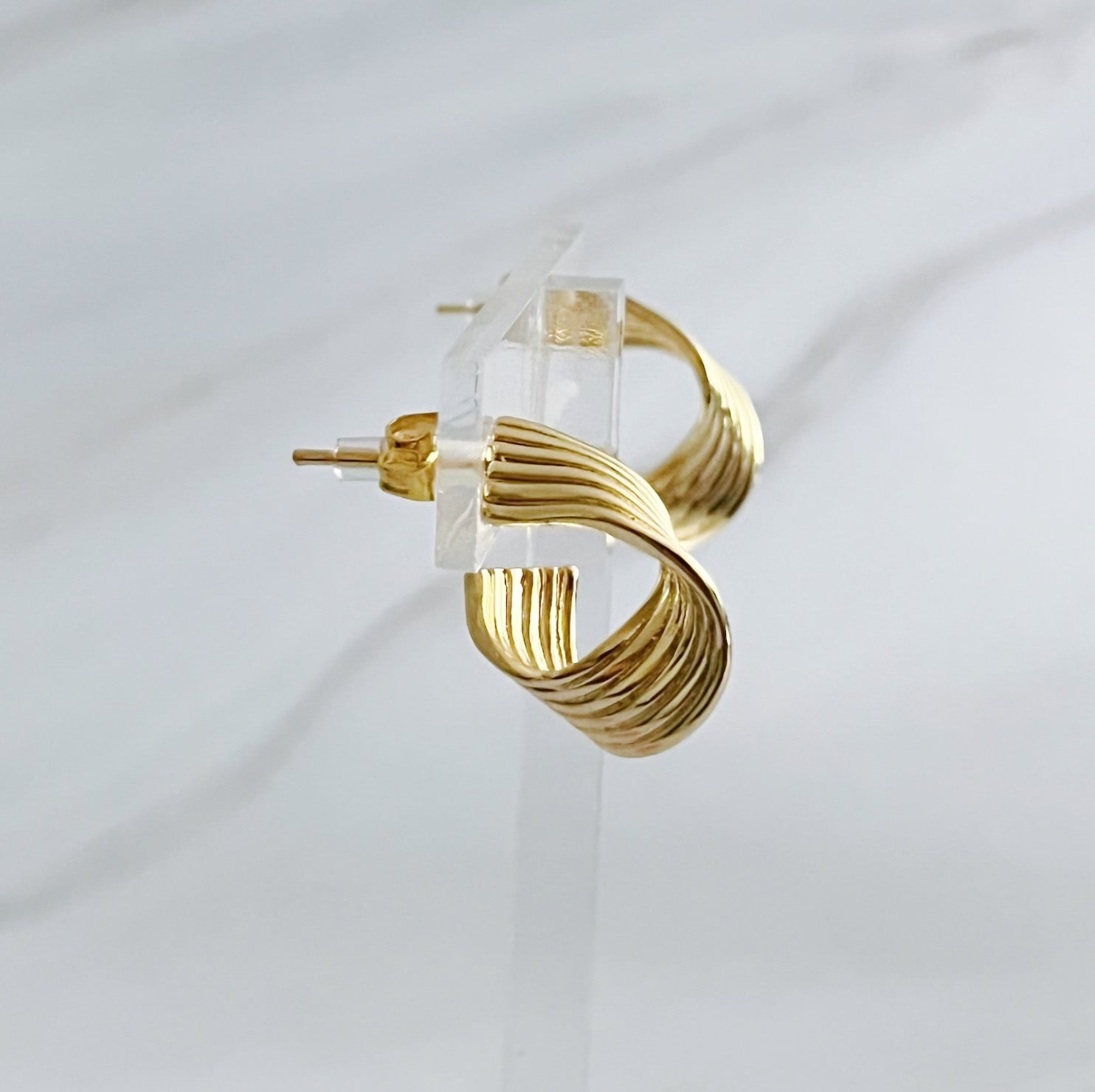 Elegant Wave Twisted Hoop Earrings in 18k gold plated brass with intricate wave design, perfect for any occasion.