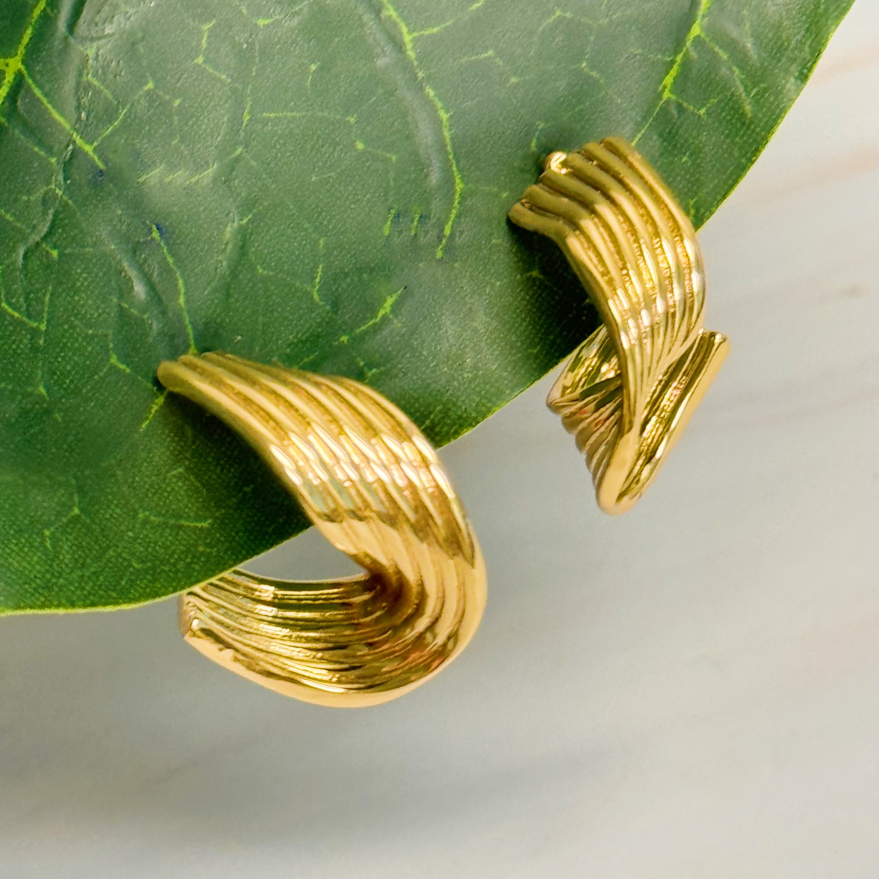 Elegant Wave Twisted Hoop Earrings in 18k gold plated brass with intricate wave design, perfect for any occasion.